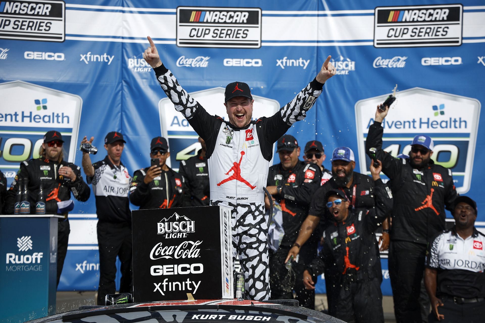 Kurt Busch celebrates in victory lane after winning the NASCAR Cup Series AdventHealth 400 at Kansas Speedway (Photo by Chris Graythen/Getty Images)