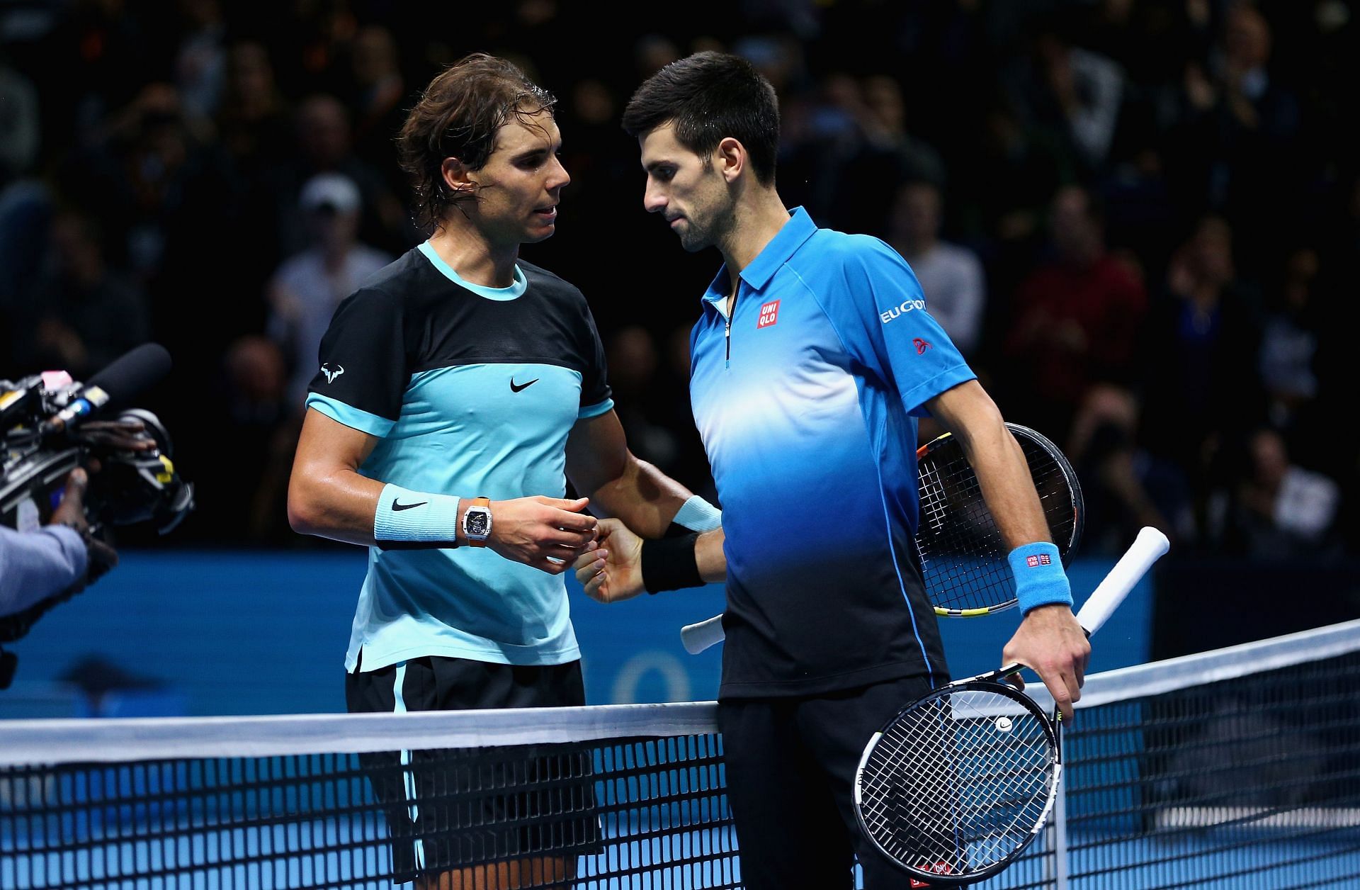 Rafael Nadal and Novak Djokovic shake hands following their match at the 2015 ATP World Tour Finals