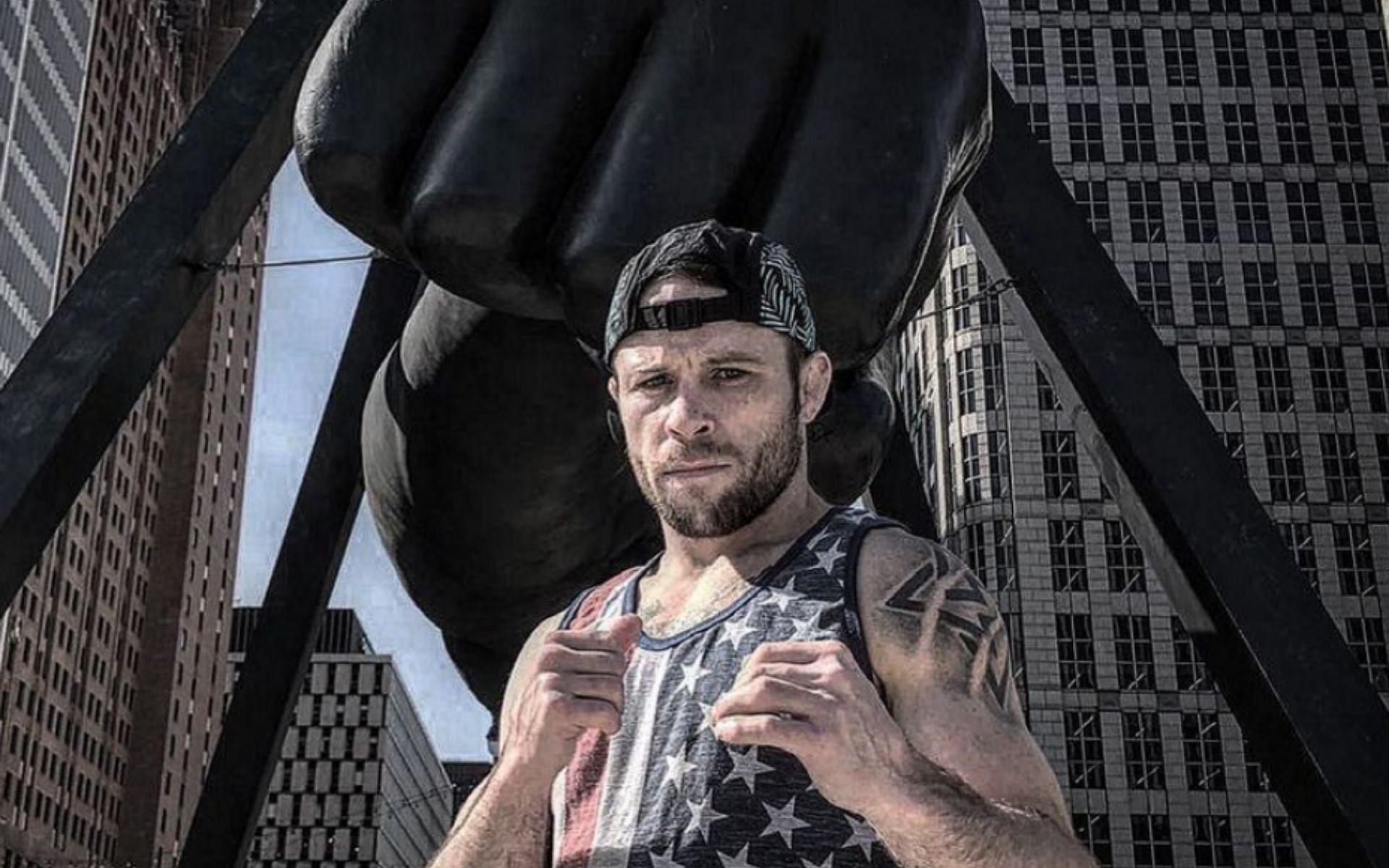 Jarred Brooks posing with the Joe Louis fist statue (Image from @the_monkeygod Instagram)