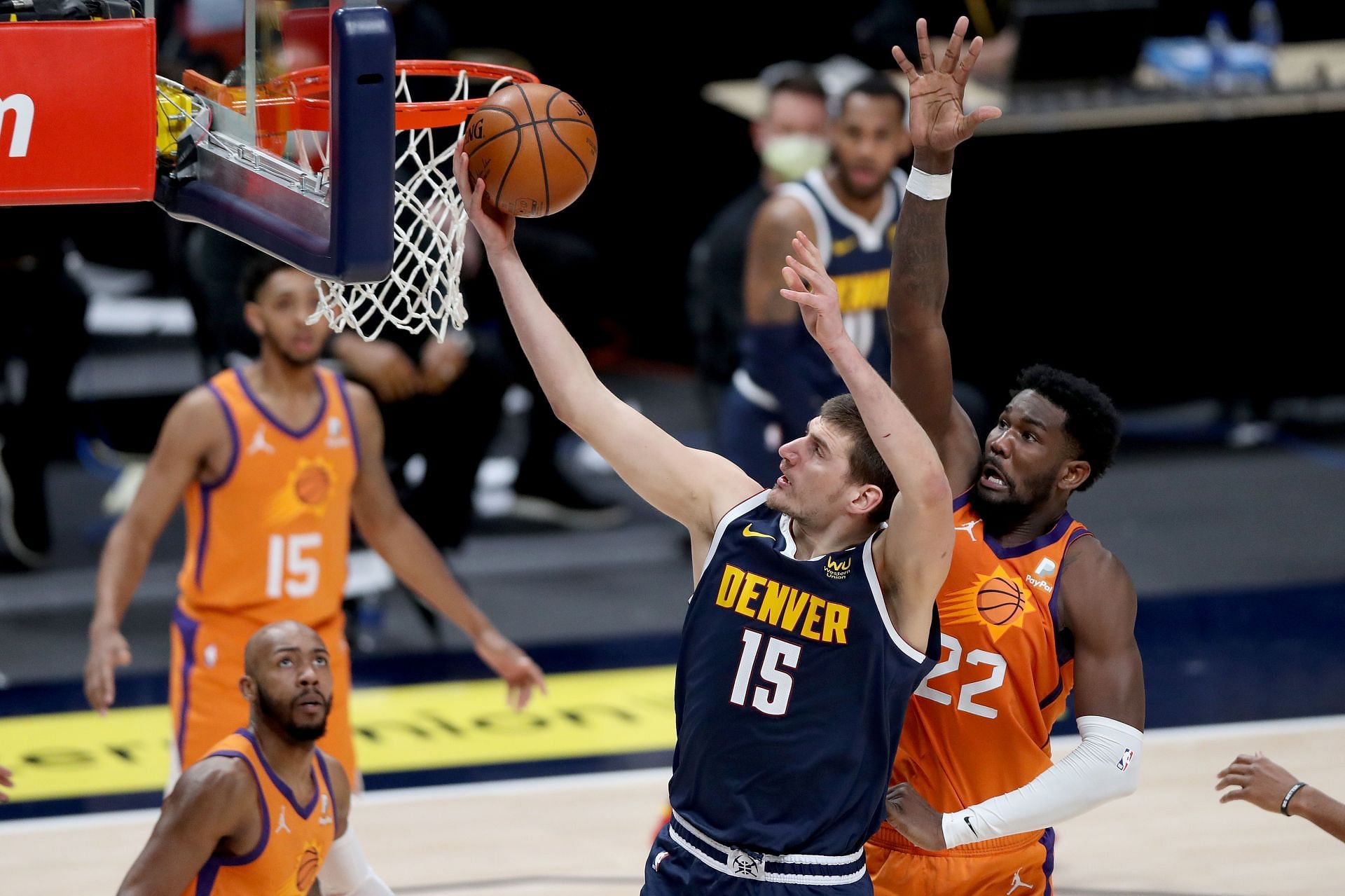 Nikola Jokic of the Denver Nuggets against Deandre Ayton of the Phoenix Suns in the 2021-22 NBA season