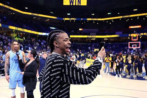 Ja Morant of the Memphis Grizzlies celebrates with his teammates after they defeated the Golden State Warriors in Game 5.