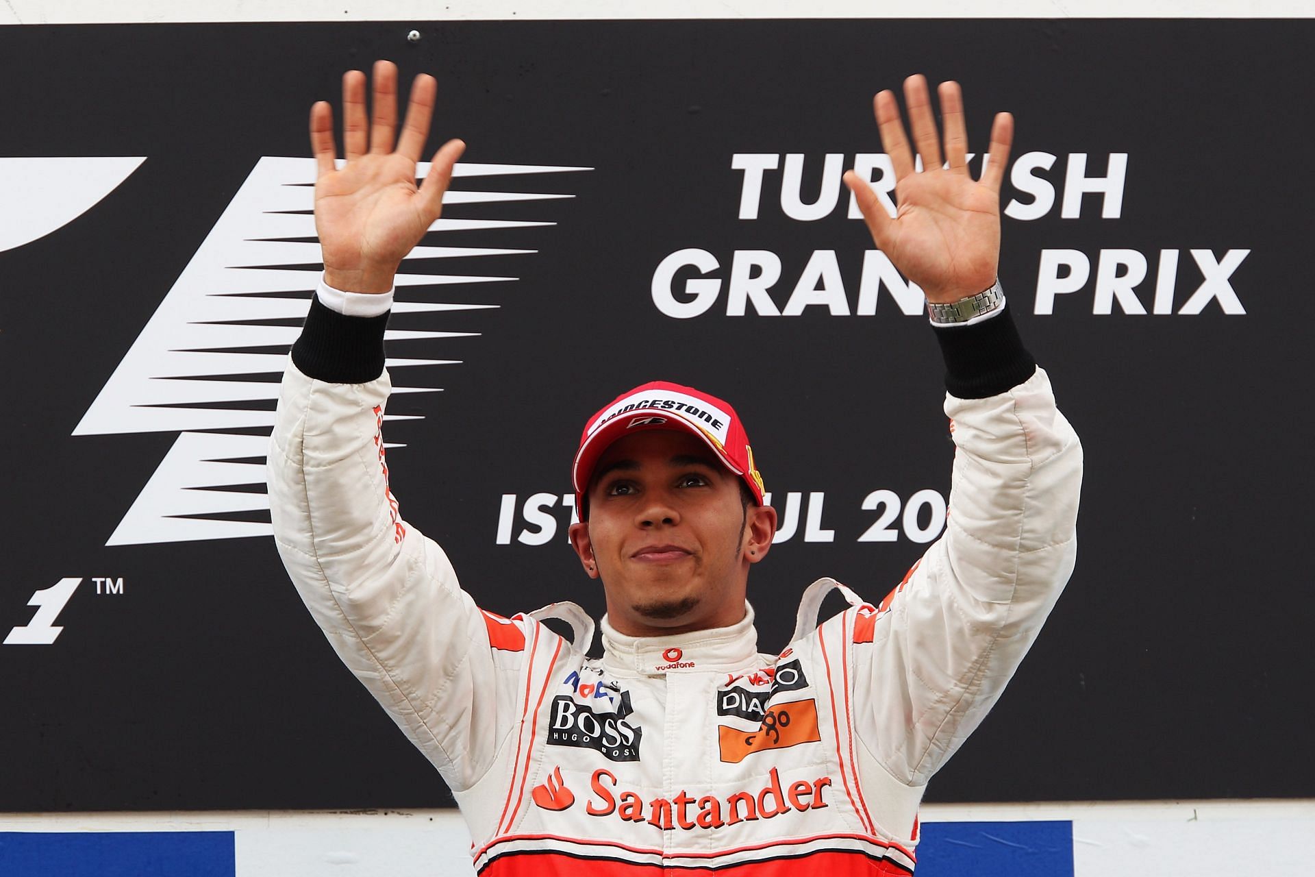 Lewis Hamilton celebrates on the podium after winning the Turkish Formula One Grand Prix for McLaren Mercedes on May 30, 2010 (Photo by Mark Thompson/Getty Images)