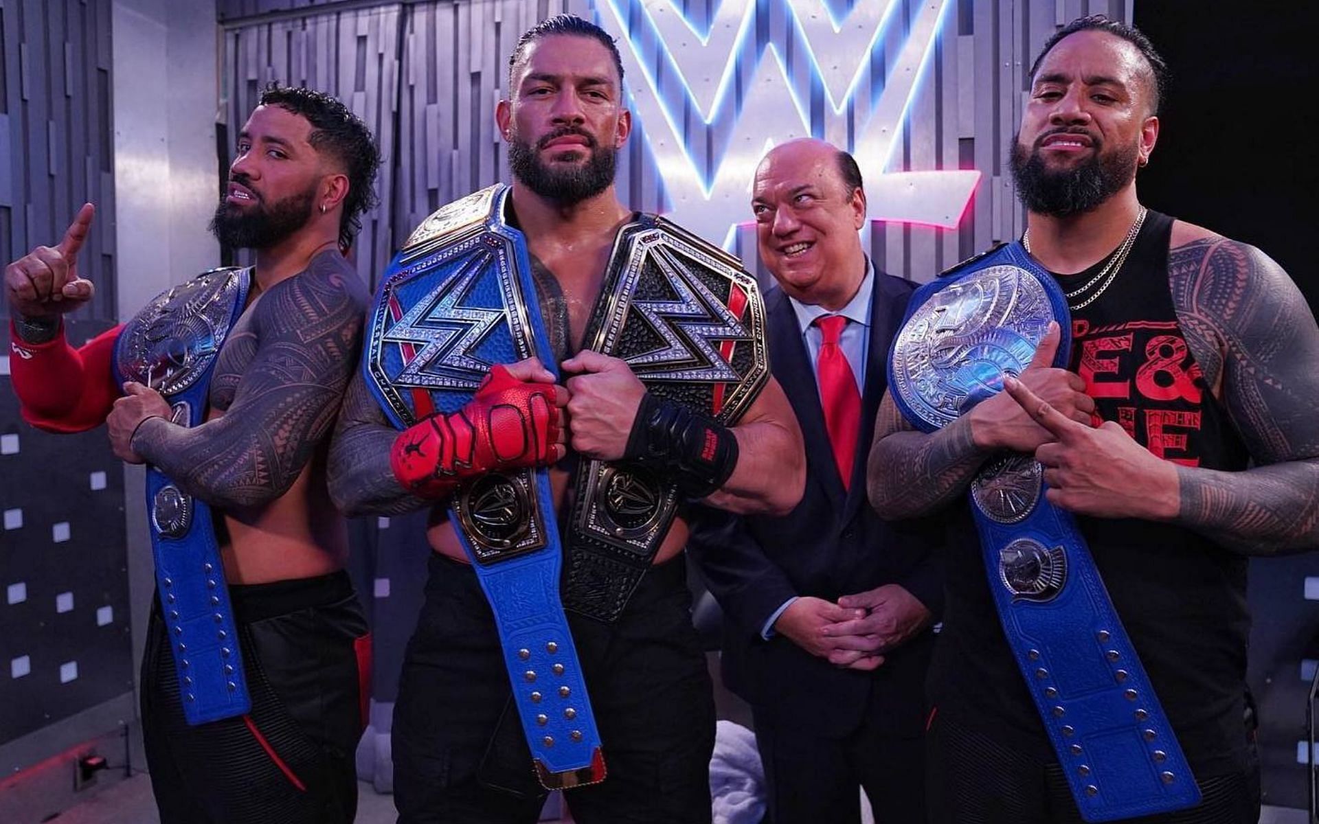 Roman Reigns, The Usos, and Paul Heyman as The Bloodline