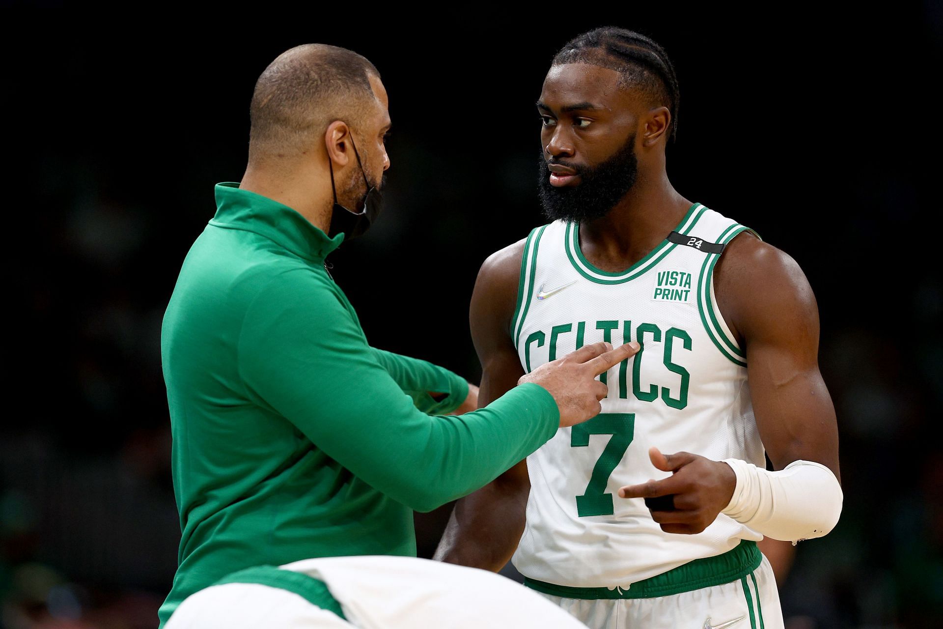 Head Coach Ime Udoka of the Boston Celtics talks with Jaylen Brown.