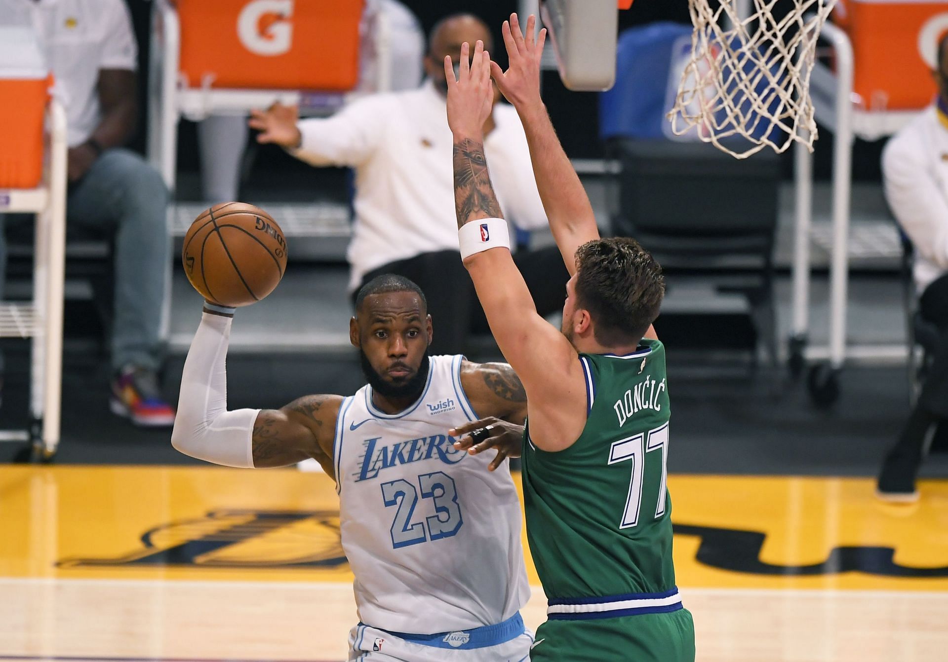 LeBron James is defended by Luka Doncic during an NBA game.