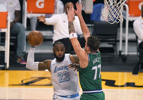 LeBron James is defended by Luka Doncic during an NBA game.