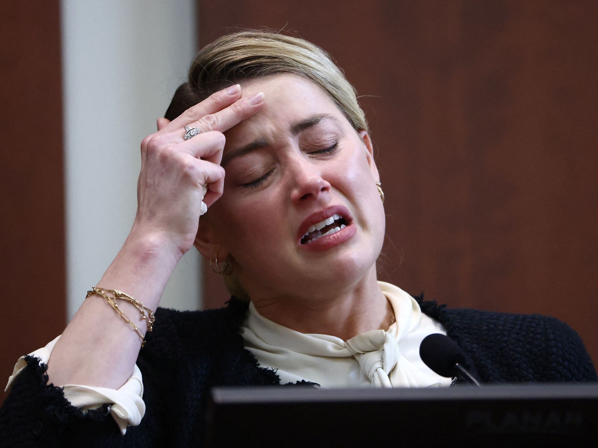 Representational image of Amber Heard crying in court (Image via Jim Lo Scalzo/POOL/AFP/Getty Images)