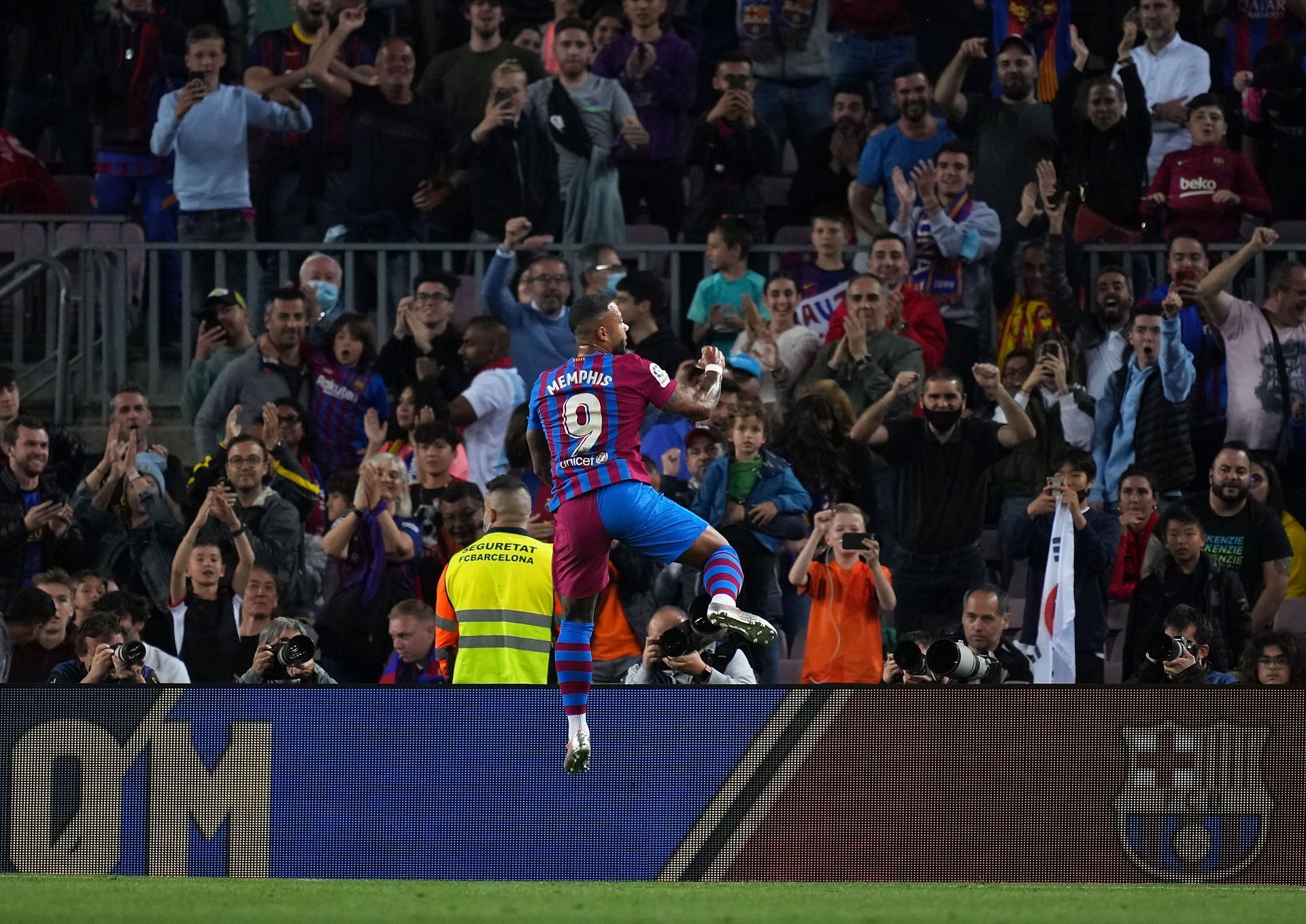 Memphis Depay rejoices after scoring a goal.