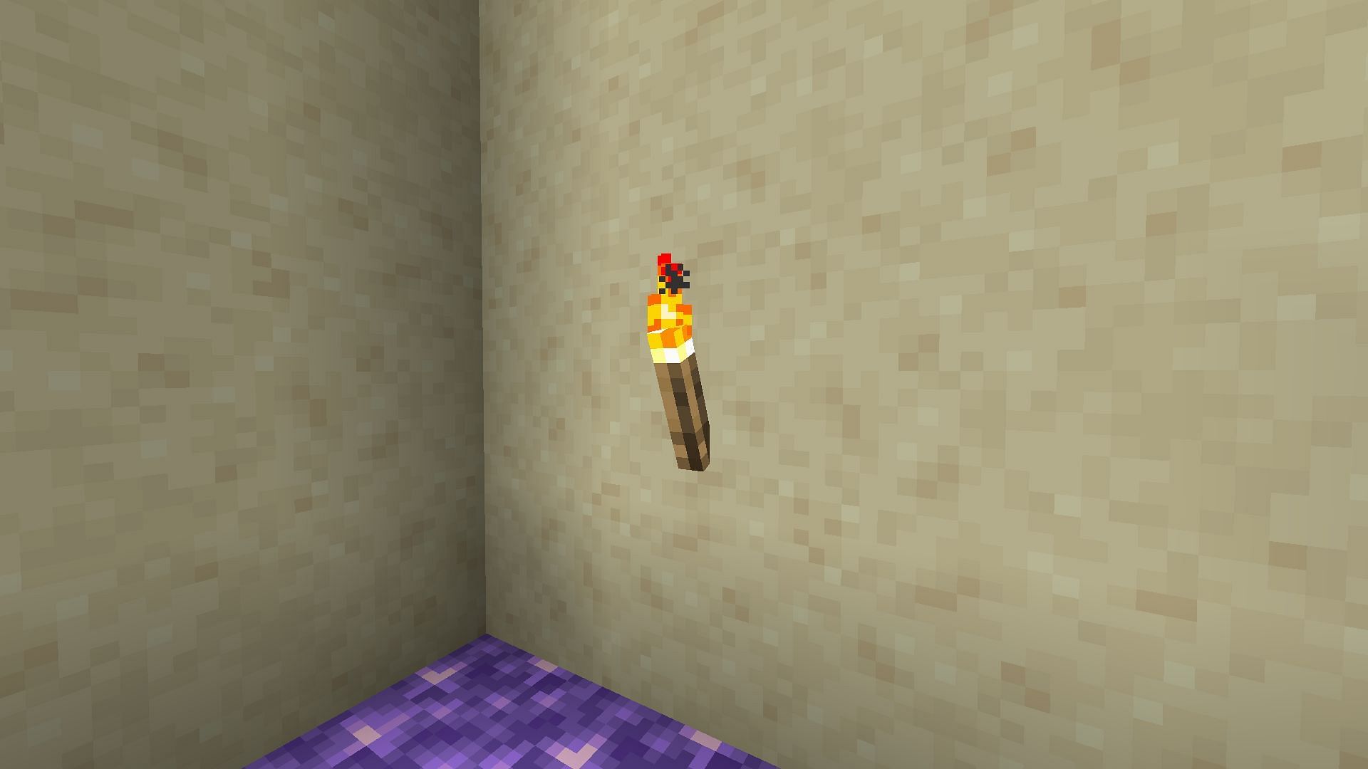 Torch on a wall (Image via Minecraft)