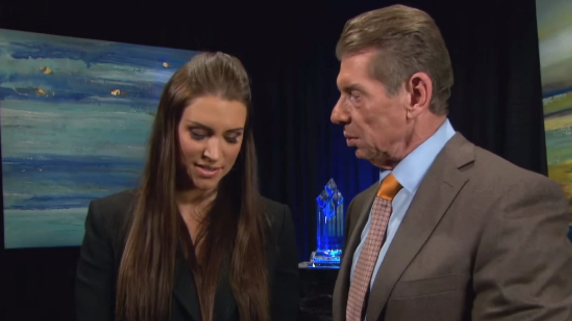 Stephanie and Vince McMahon backstage during a WWE segment.