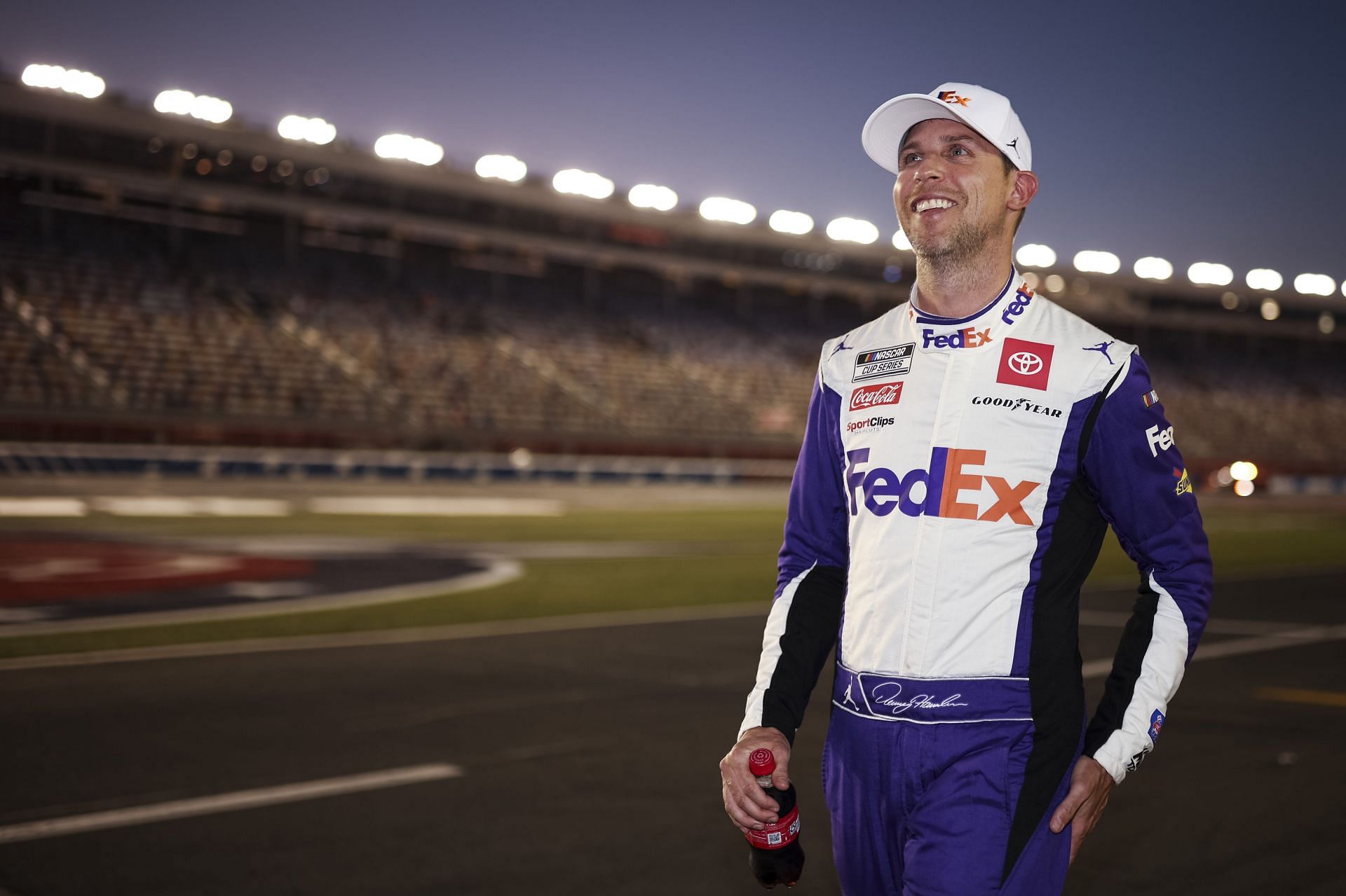 Denny Hamlin reacts after winning the pole award during qualifying for the NASCAR Cup Series Coca-Cola 600 at Charlotte Motor Speedway