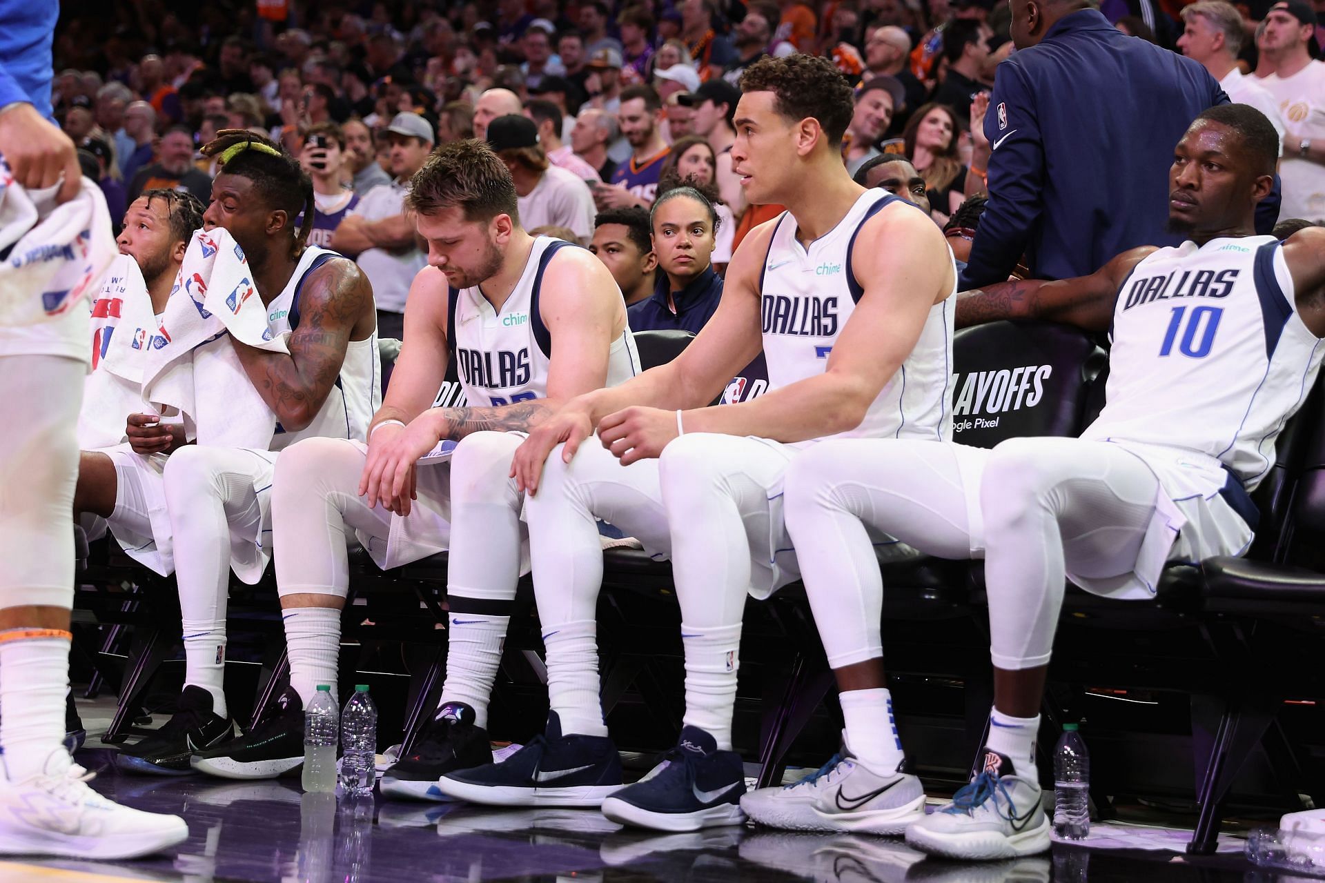 Reggie Bullock, Luka Doncic, Dwight Powell and Dorian Finney-Smith, left to right, of the Dallas Mavericks