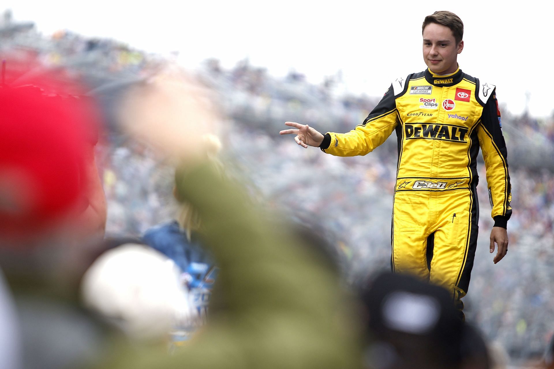 Christopher Bell waves to fans during the driver intros before the 2022 NASCAR Cup Series DuraMAX Drydene 400 presented by RelaDyne at Dover Motor Speedway in Dover, Delaware. (Photo by Sean Gardner/Getty Images)