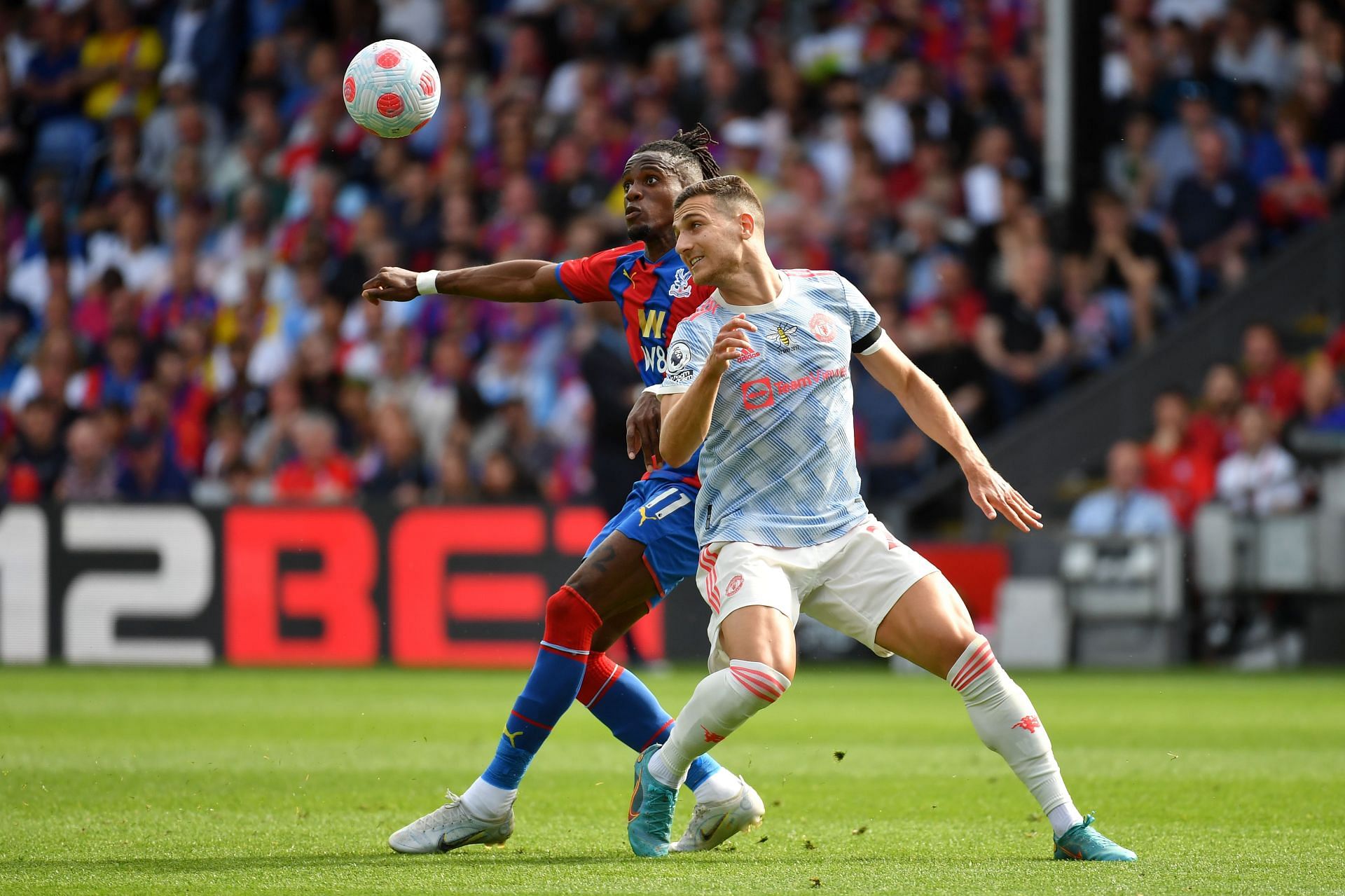 Dalot (R) was given a torrid time by Zaha and struggled to keep up with the Ivorian