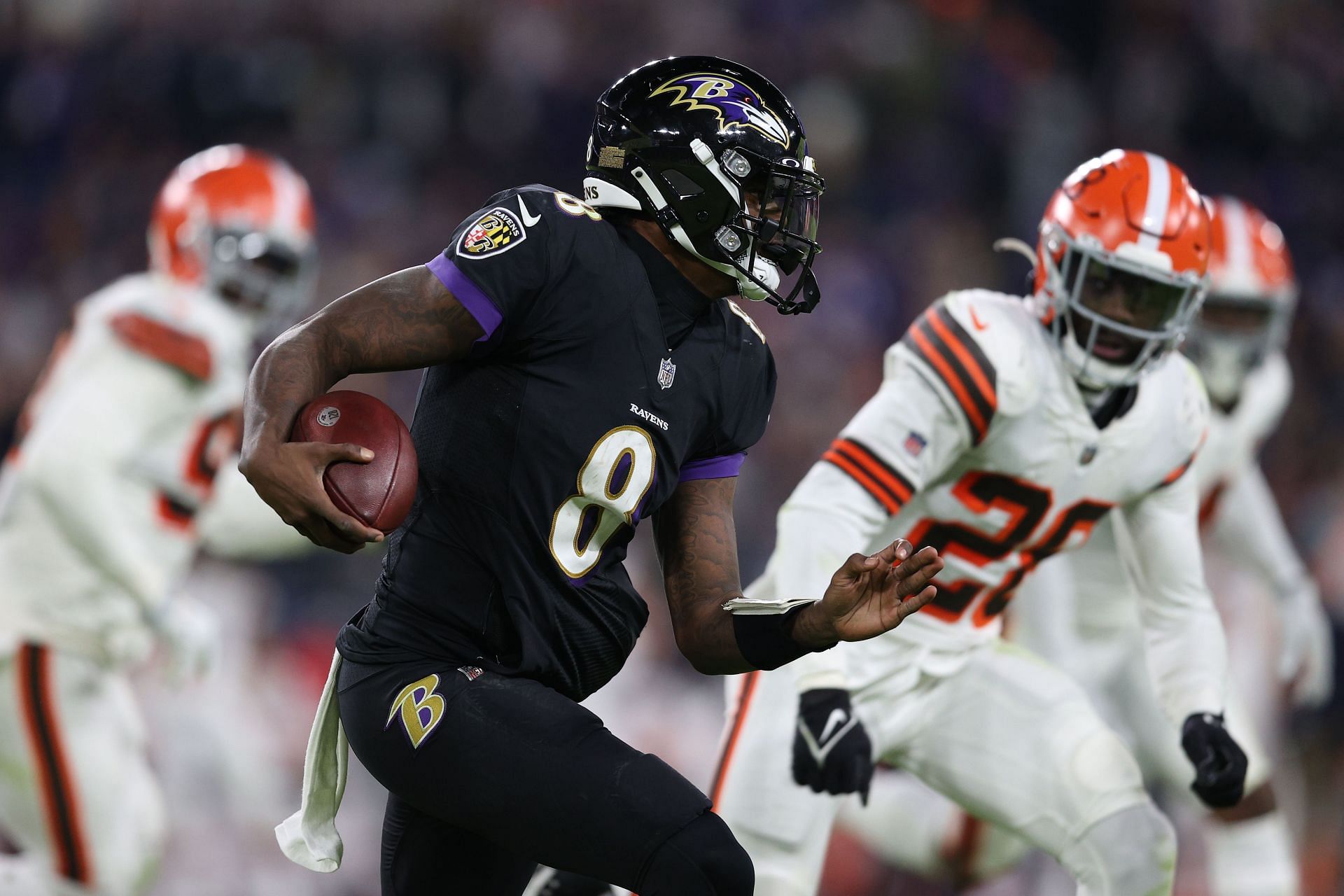 Baltimore Ravens quarterback Lamar Jackson carries the ball