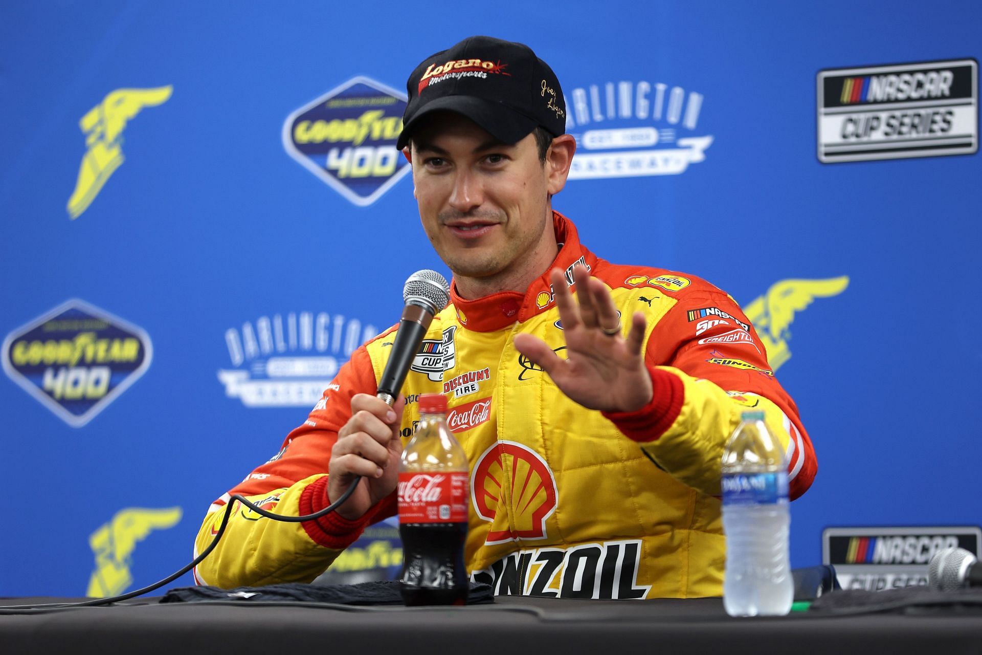 Joey Logano speaks to the media after winning the NASCAR Cup Series Goodyear 400 at Darlington Raceway.