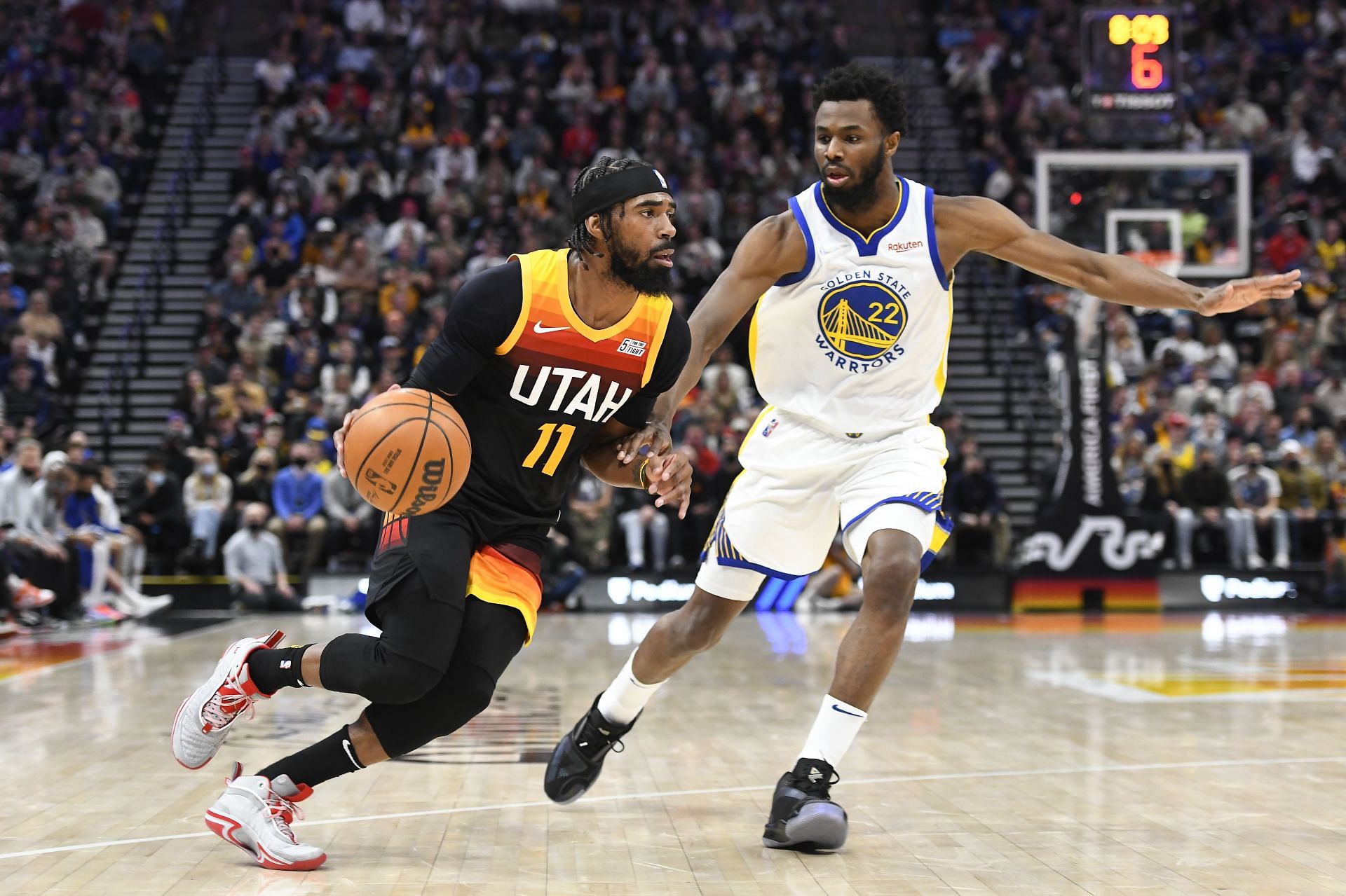 Mike Conley of the Utah Jazz and Andrew Wiggins of the Golden State Warriors