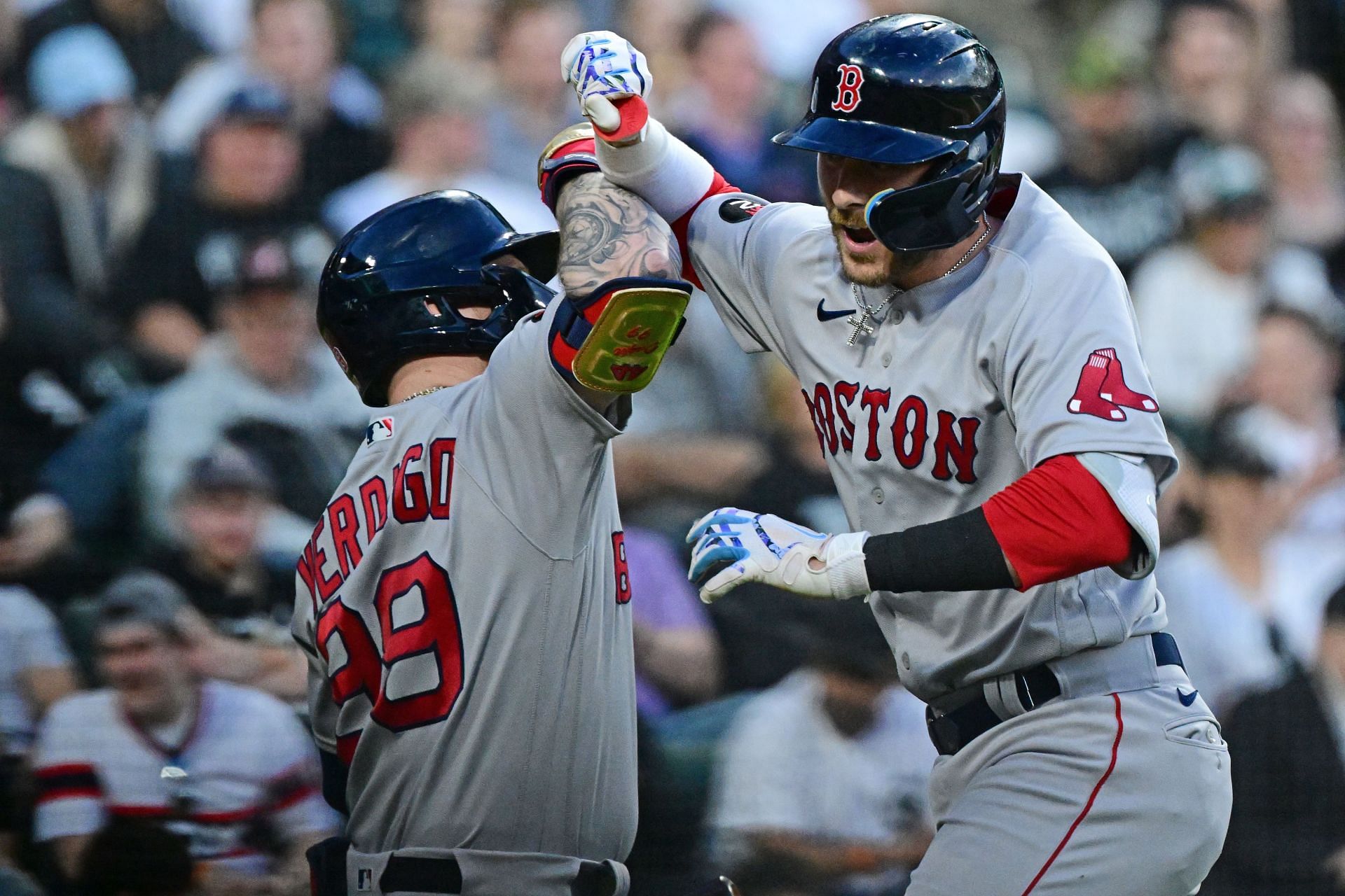 Trevor Story and Alex Verdugo of the Boston Red Sox celebrate after Story hit a three-run homer.