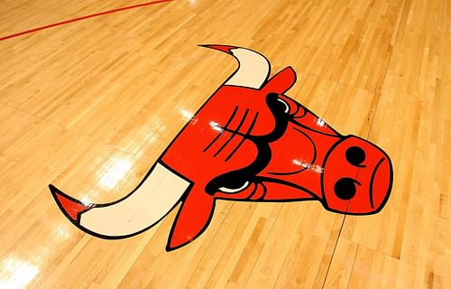 The Chicago Bulls team logo on the United Center court.