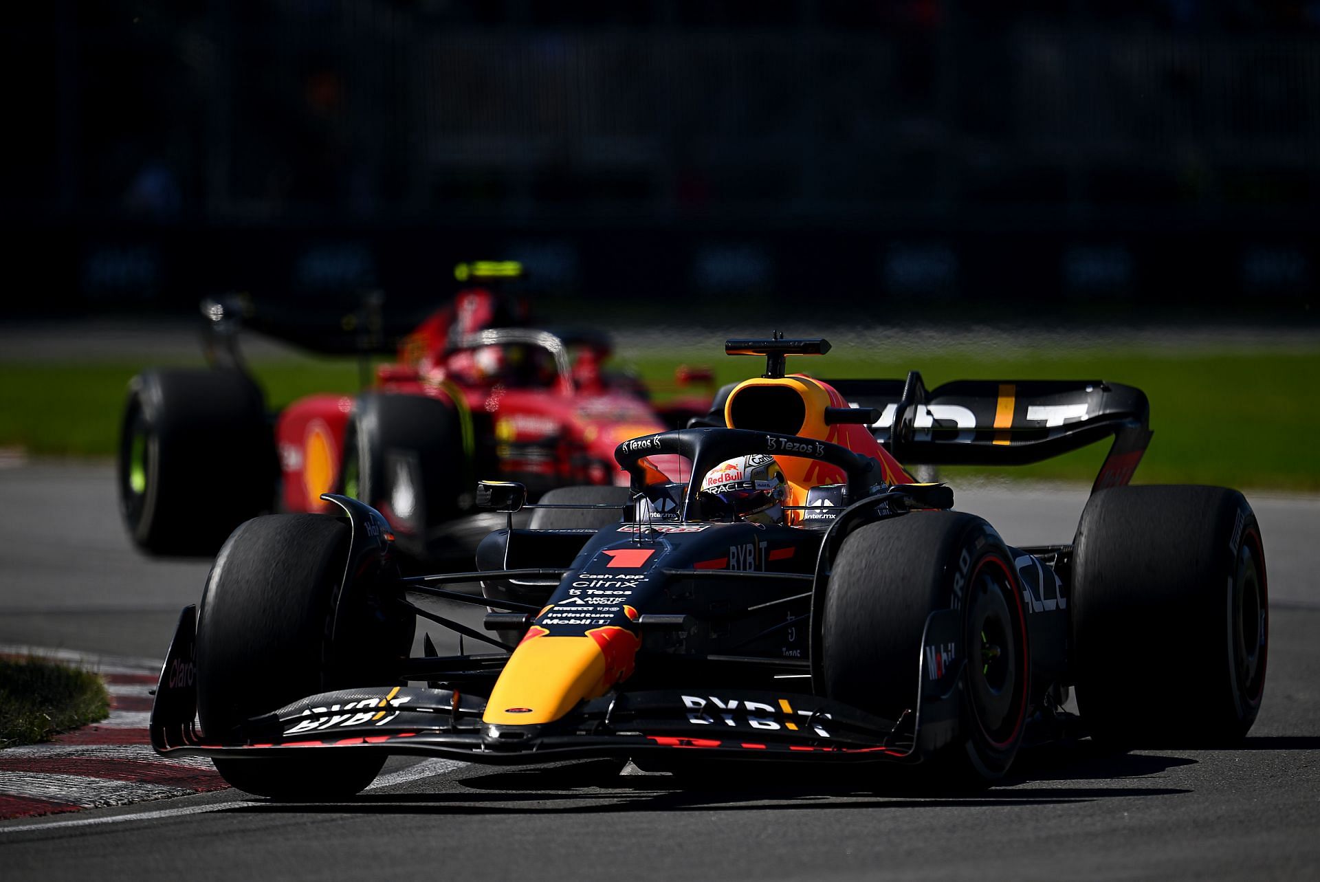 Red Bull driver Max Verstappen (foreground) being chased by Ferrari&#039;s Carlos Sainz during the 2022 F1 Canadian GP. (Photo by Clive Mason/Getty Images)