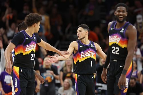 Cam Johnson (23) and Devin Booker (1) of the Phoenix Suns.