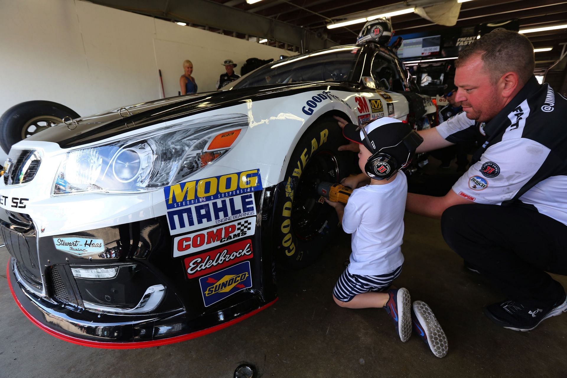 Keelan Harvick, son of Kevin Harvick, works on his dad&#039;s car in the garage area during practice for the 2016 NASCAR Sprint Cup Series New Hampshire 301 at New Hampshire Motor Speedway in Loudon, New Hampshire. (Photo by Jerry Markland/Getty Images)