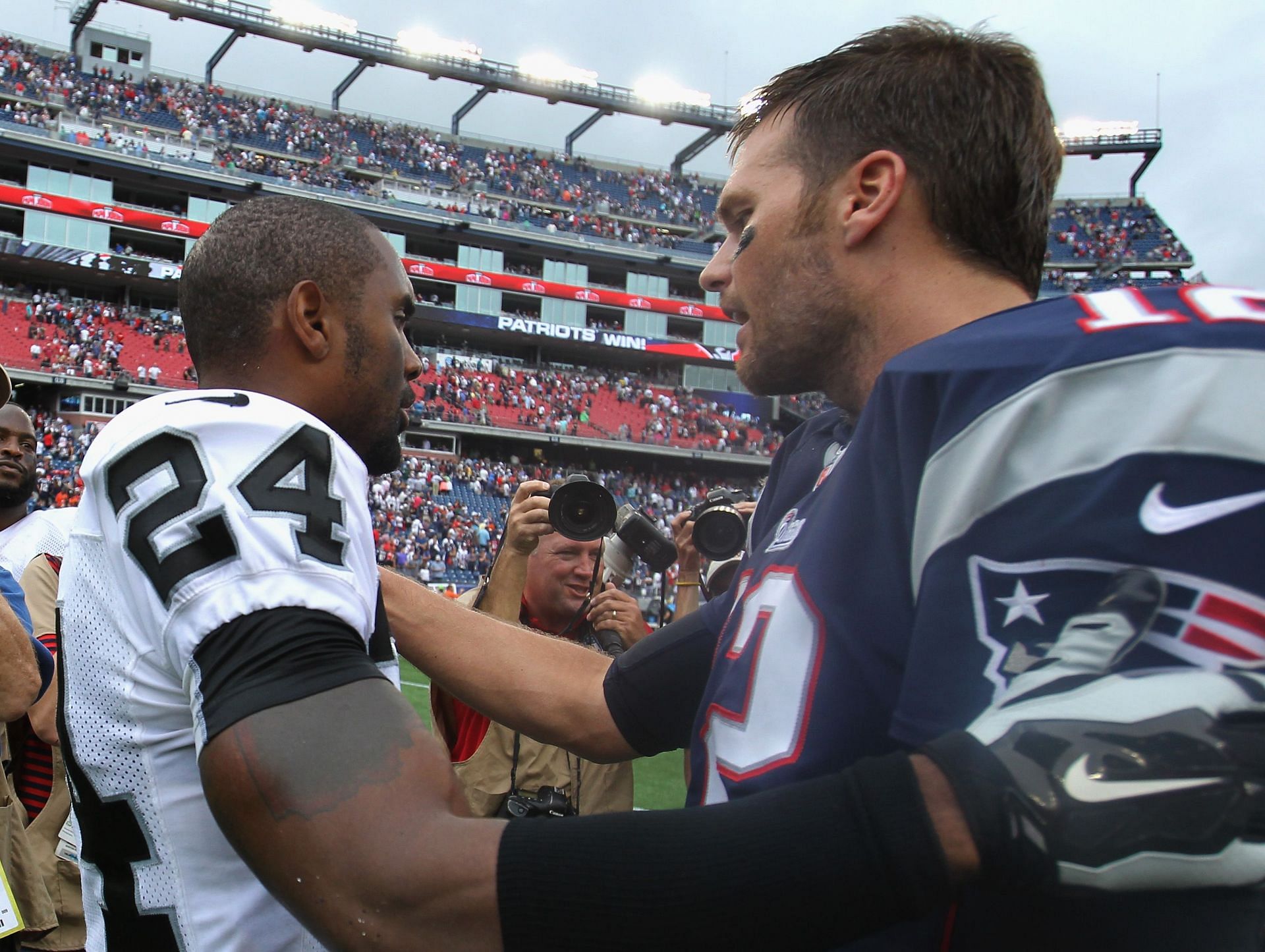 Raiders Charles Woodson and Patriots Tom Brady