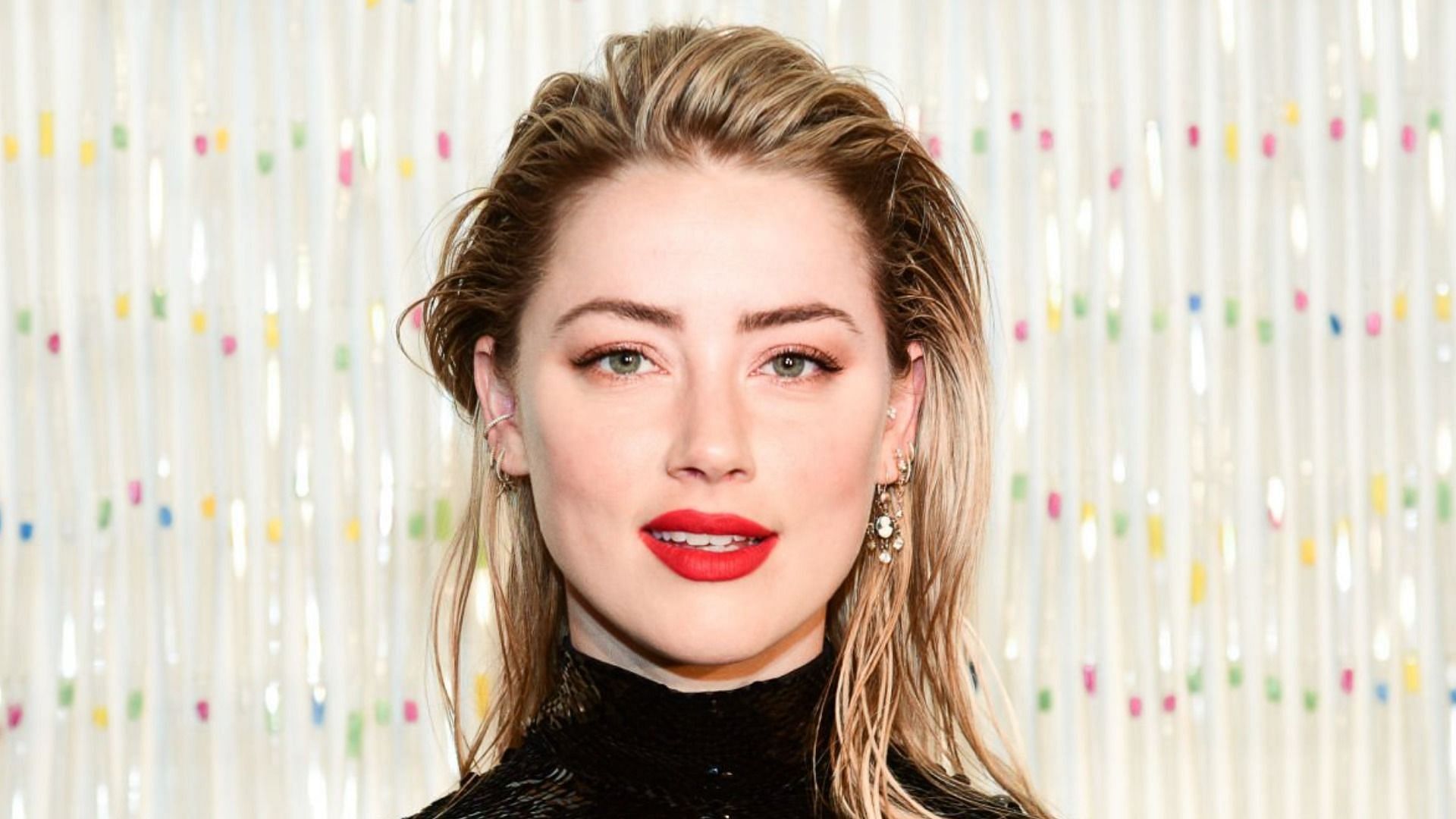 Celebrity Net Worth reveals Amber Heard has a net worth of -8 million (Image via Getty Images)