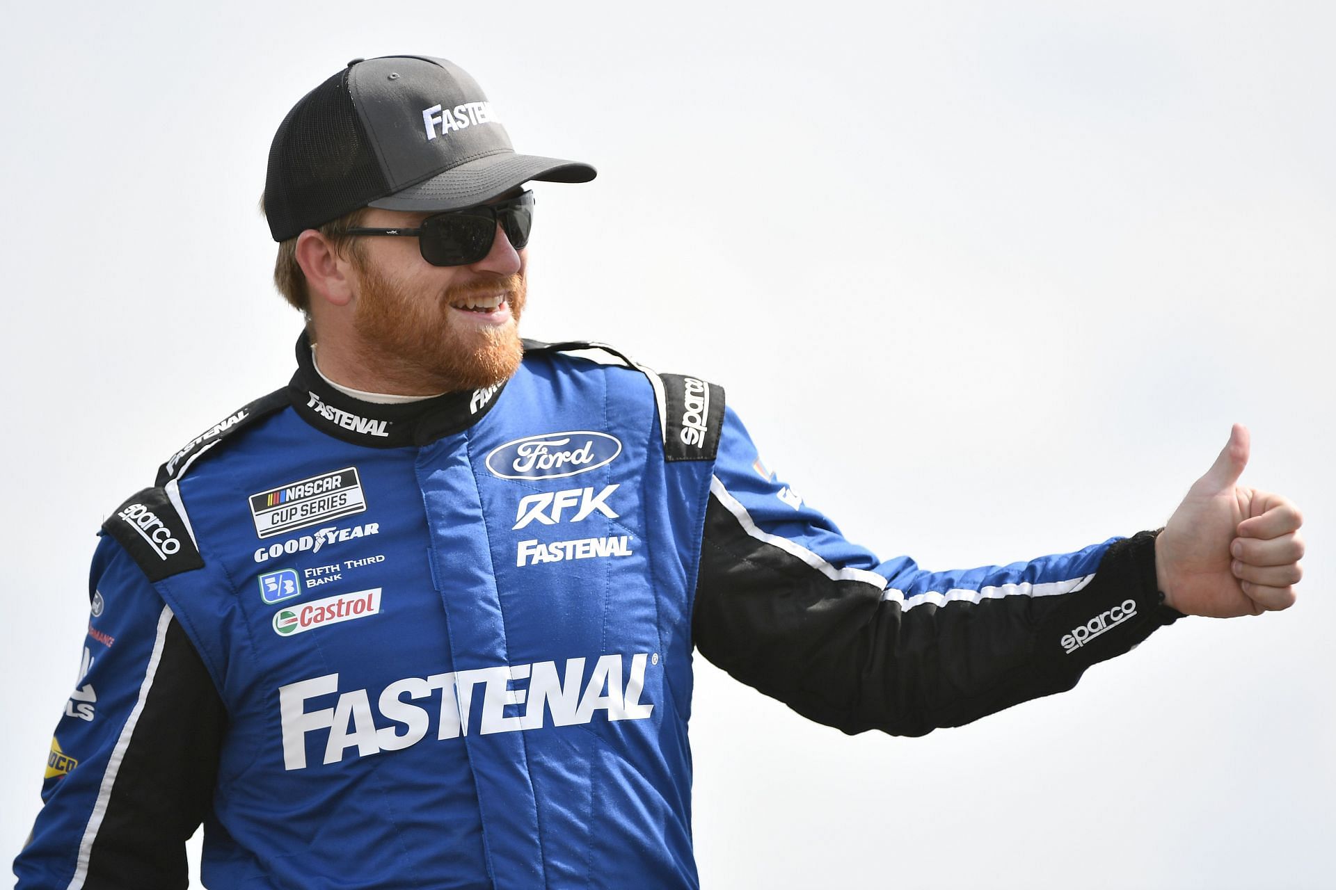 Chris Buescher gives a thumbs up to fans onstage during driver intros before the 2022 NASCAR Cup Series Ally 400 at Nashville Superspeedway in Lebanon, Tennessee (Photo by Logan Riely/Getty Images)