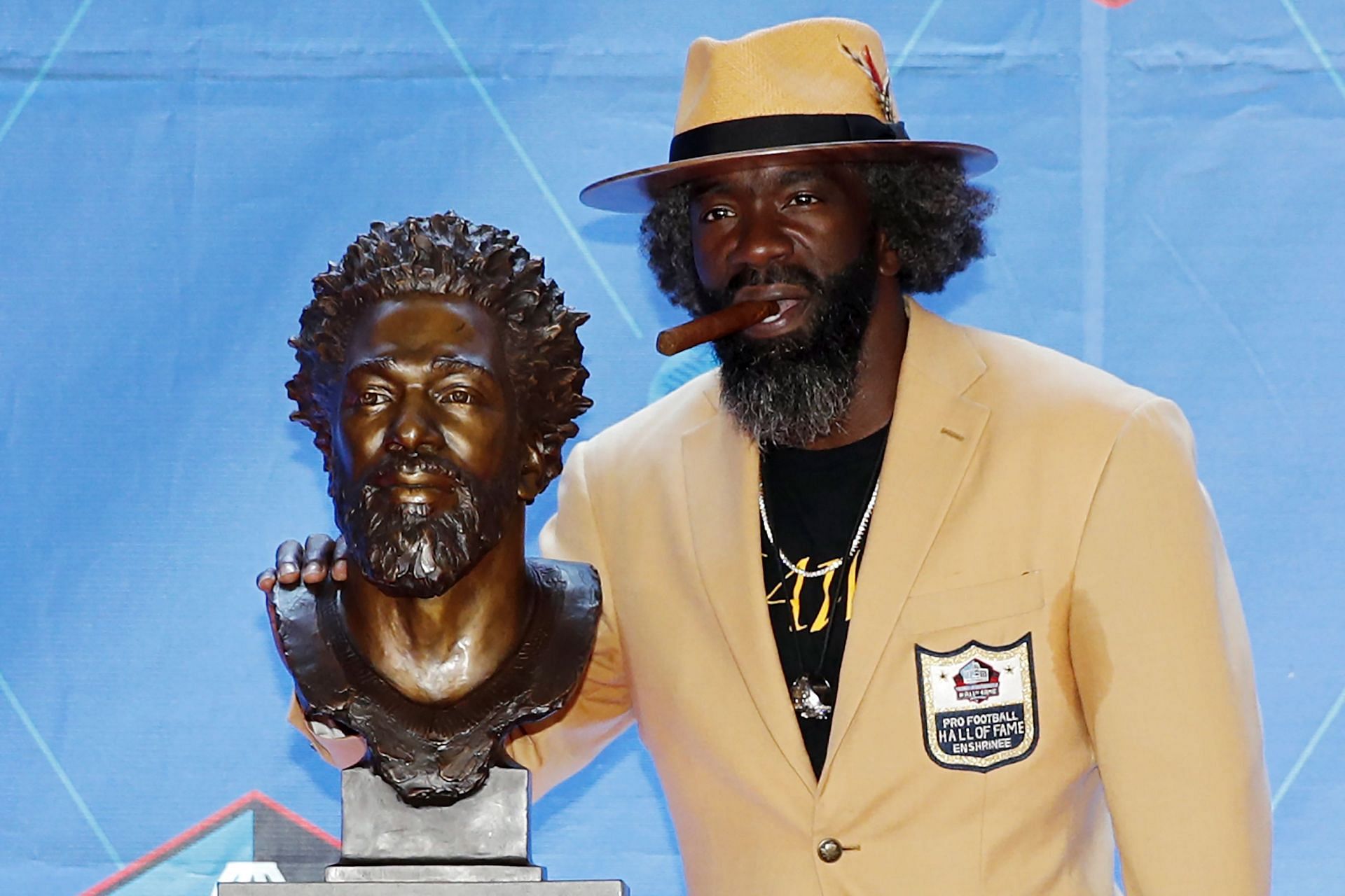 Ed Reed poses with his Hall of Fame bust