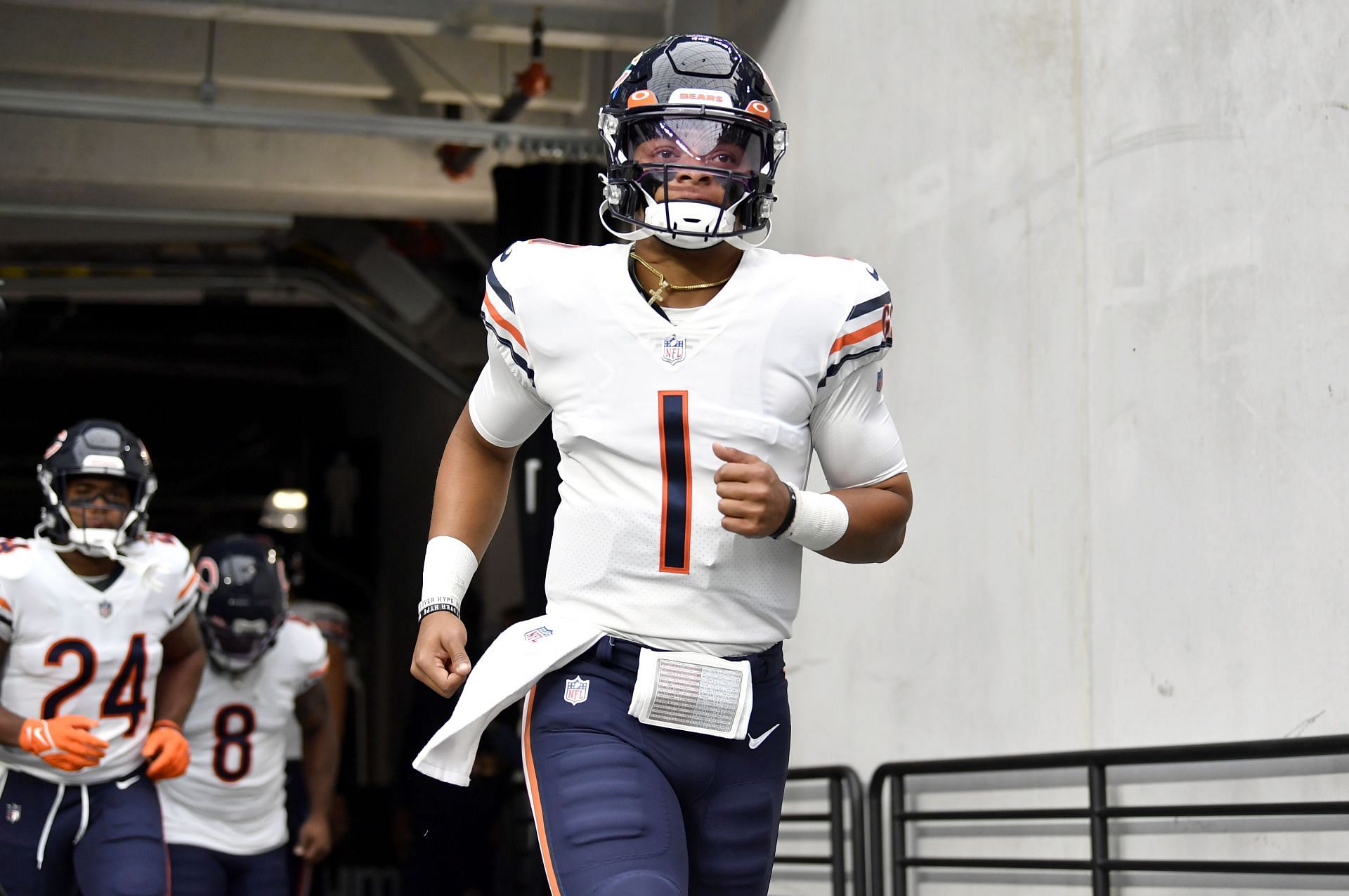 Justin Fields of the Chicago Bears runs out of the tunnel to play the Las Vegas Raiders.