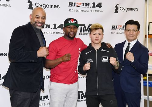 Floyd Mayweather (in red) went to Japan in 2018 to face Tenshin Nasukawa (third from left)