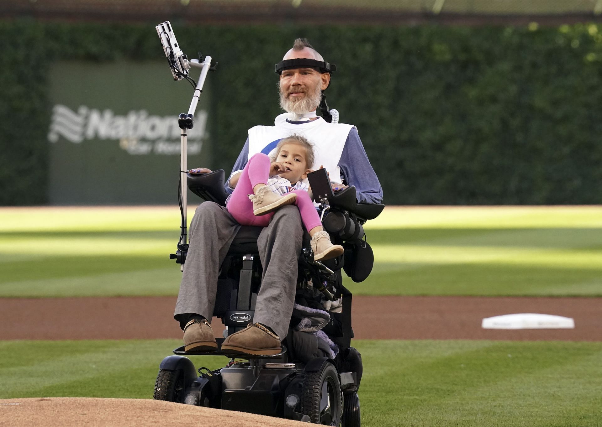 Steve Gleason, a sufferer of Amyotrophic Lateral Sclerosis (ALS), holds his daughter Gray