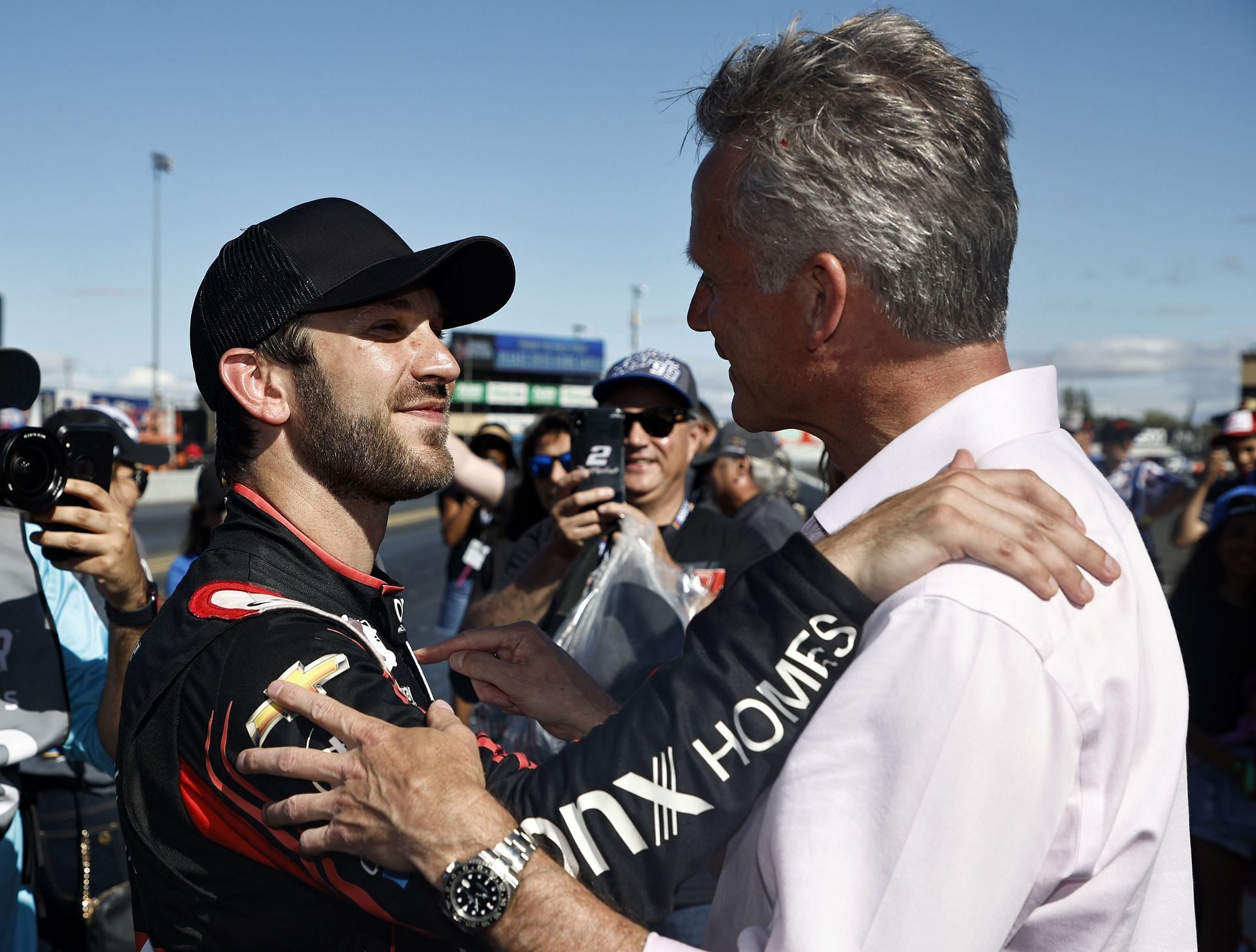 Daniel Suarez is congratulated by NASCAR president Steve Phelps after winning the NASCAR Cup Series Toyota/Save Mart 350 at Sonoma Raceway