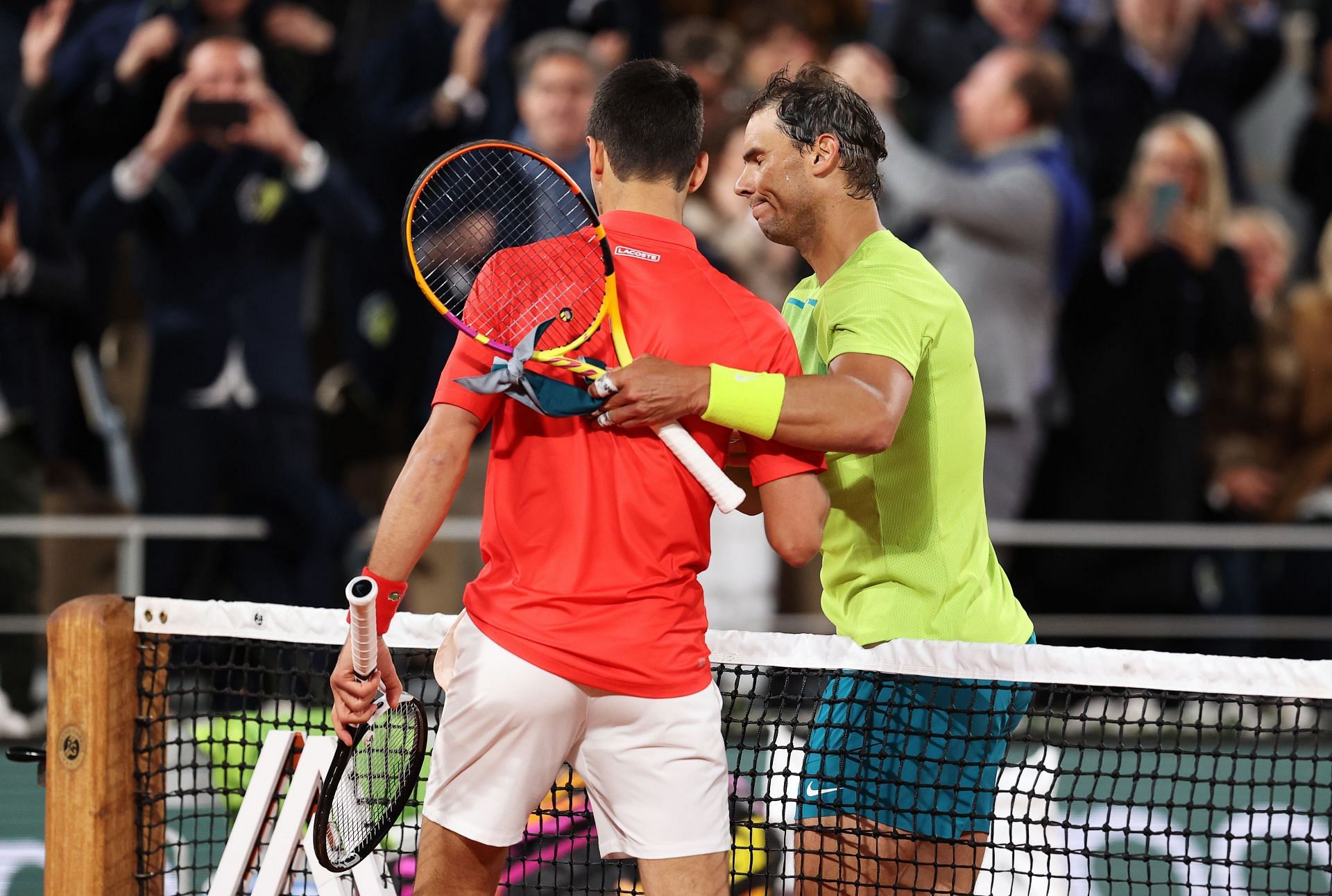 Novak Djokovic and Rafael Nadal shake hands after 2022 French Open quarterfinal.