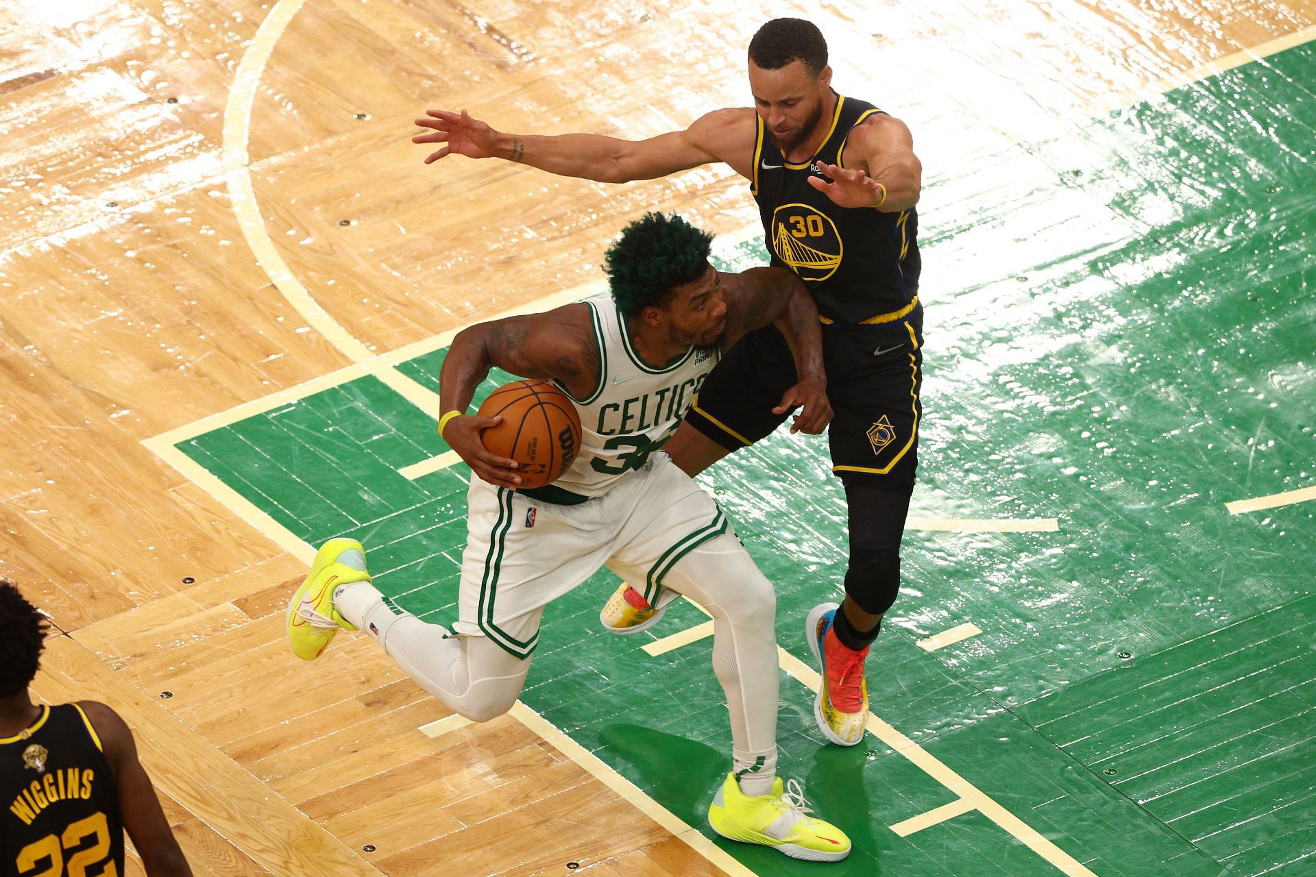 Marcus Smart and Steph Curry in action during the 2022 NBA Finals - Game Three