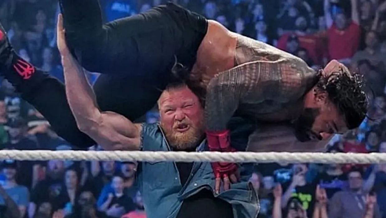 Brock Lesnar giving Roman Reigns an F-5