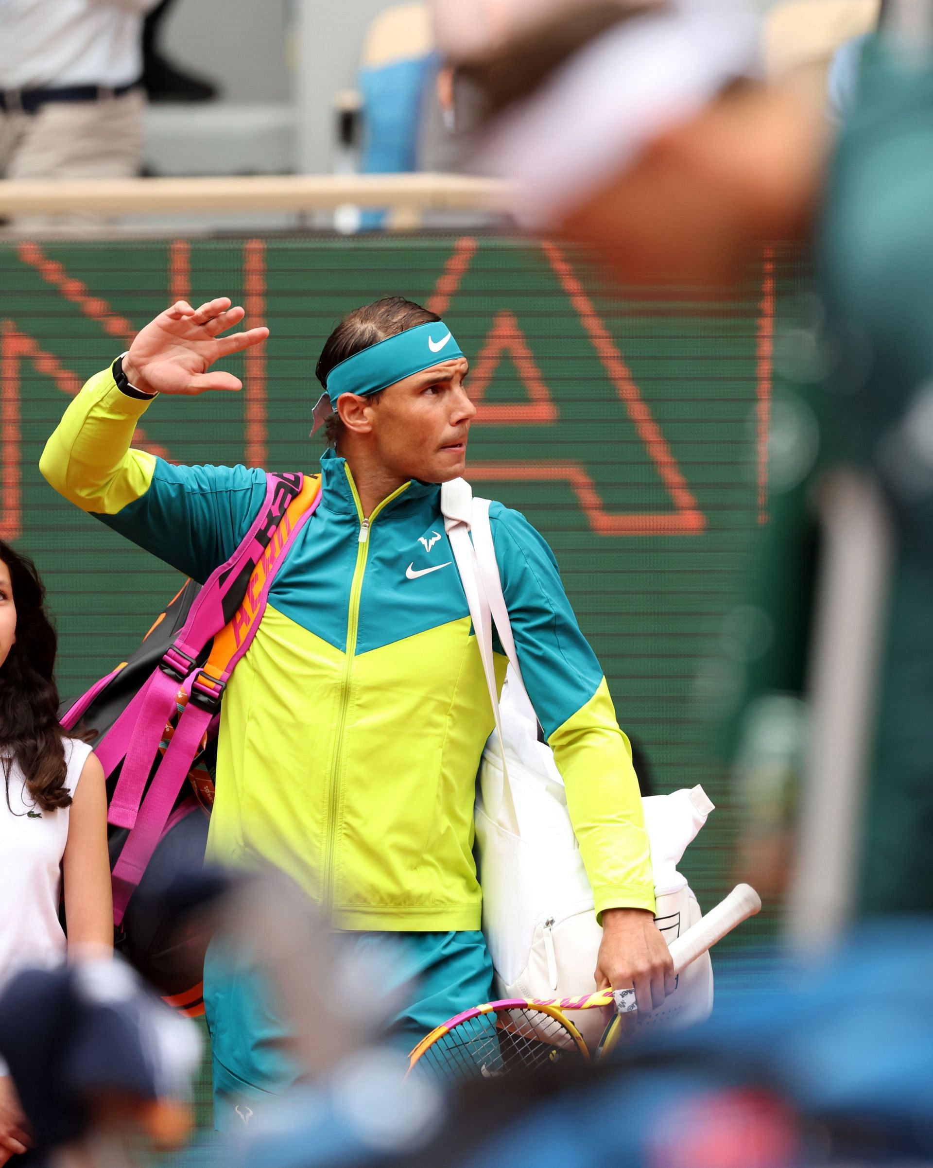 Rafael Nadal waves towards the crowd at the French Open