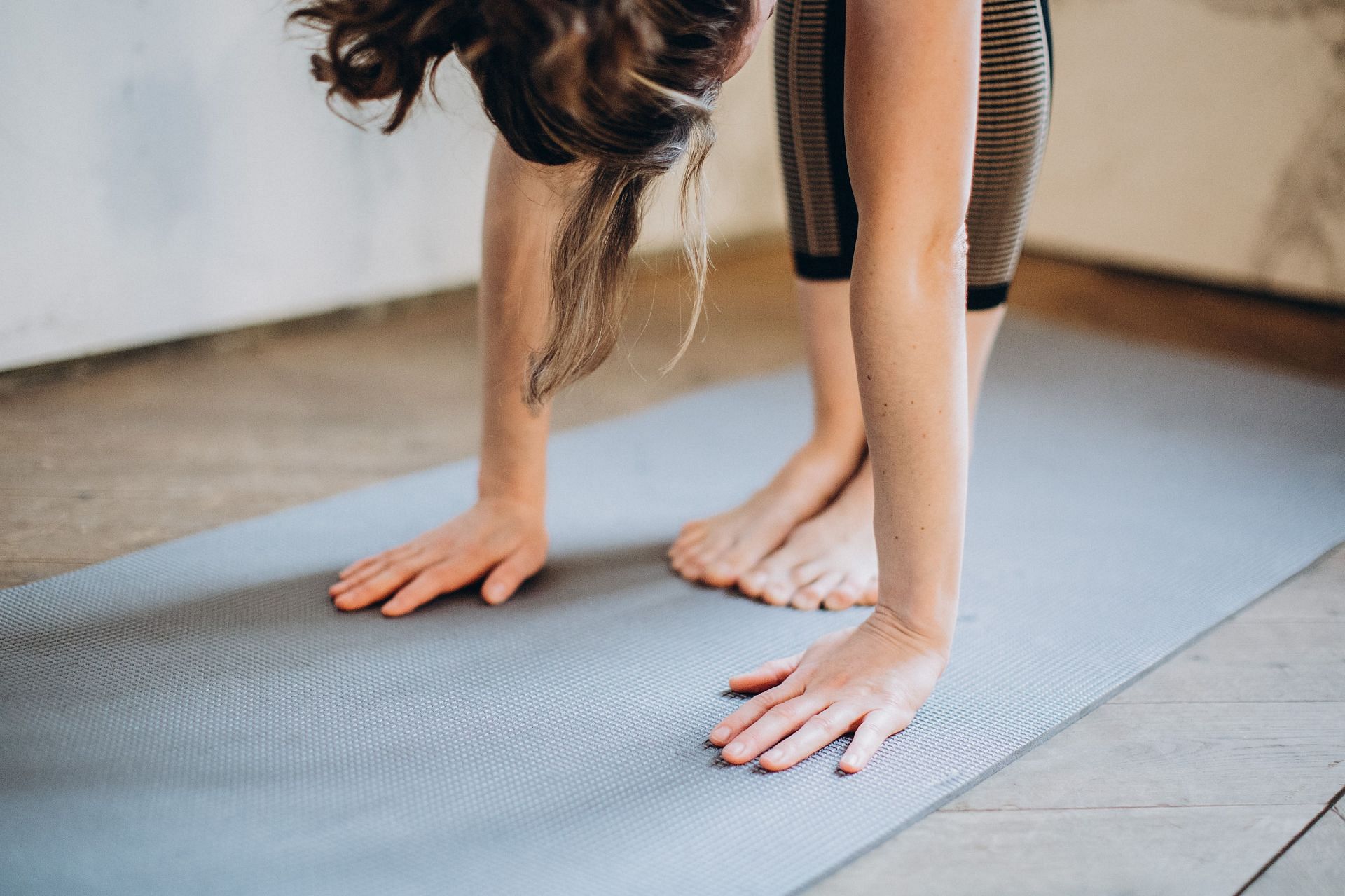 Wall Roll Downs are one of the most challenging pilate exercises. (Image via Pexels / Elina Fairytale)