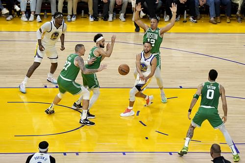 Steph Curry of the Golden State Warriors passes out of the paint during Game 2 of the 2022 NBA Finals.