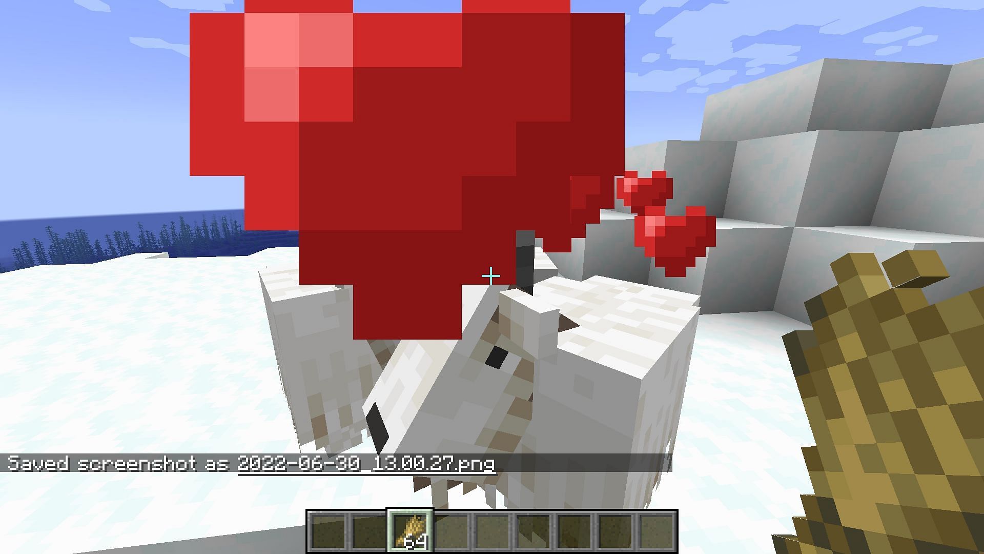 Heart particles over the mob after feeding them wheat (Image via Mojang)