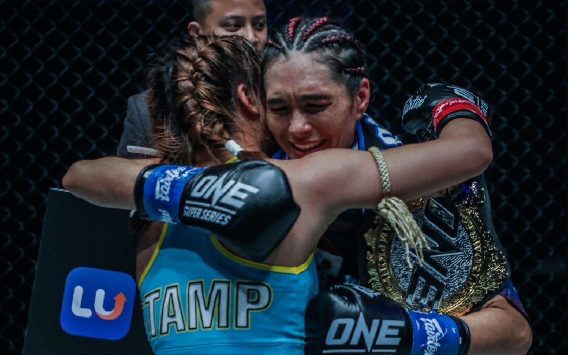 Janet Todd (right) embraces Stamp Fairtex (left) after her title win in February 2020. [Photo ONE Championship]