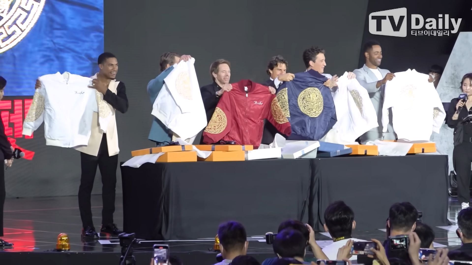 The Top Gun: Maverick team with their gonryongpo gifts (Image via TV Daily/YouTube)