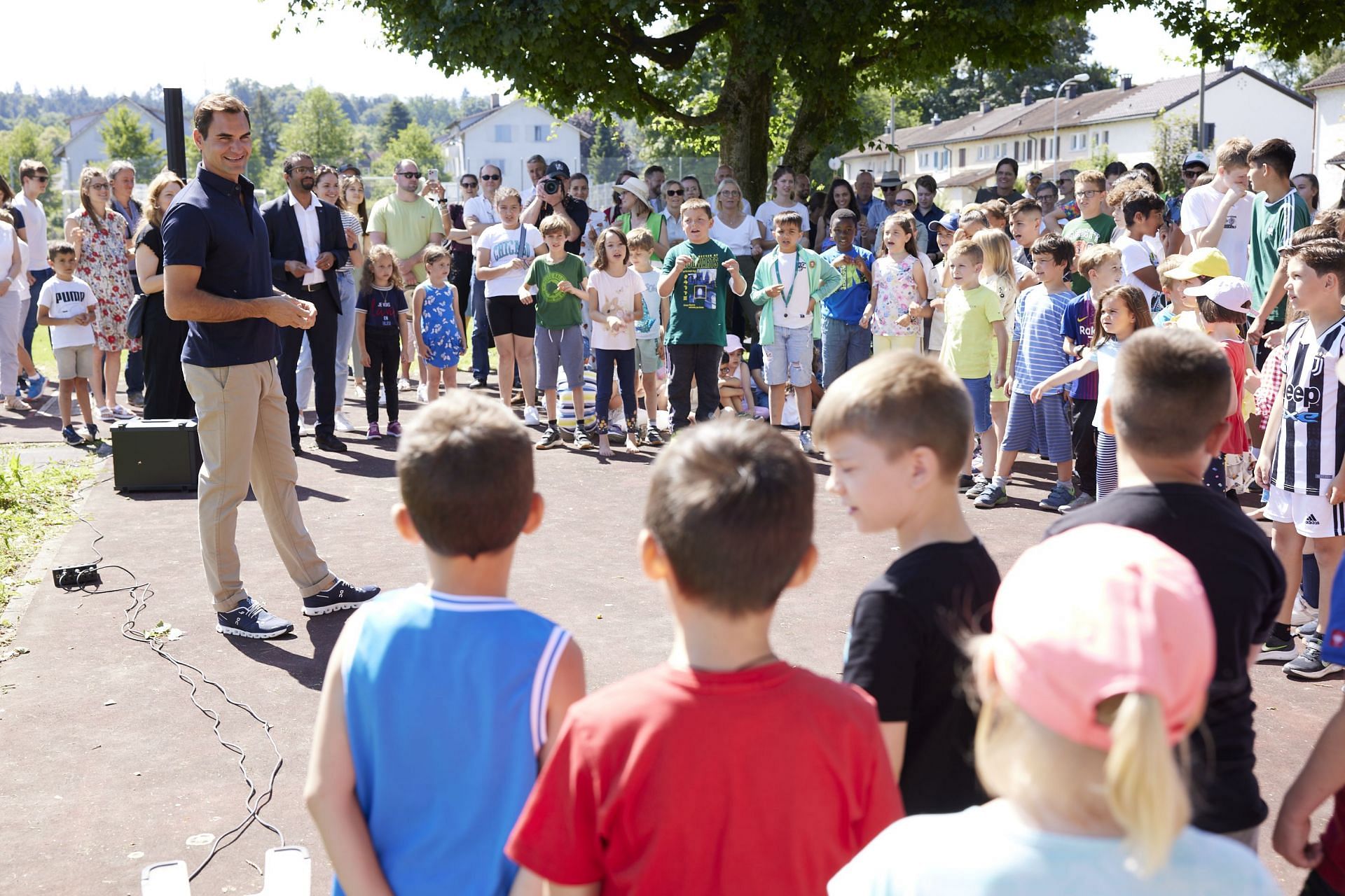 Roger Federer attends an inauguration of one of his foundation&#039;s Natural School Playgrounds projects in Emmen, Lucerne (Photo courtesy of the Roger Federer Foundation Twitter account)