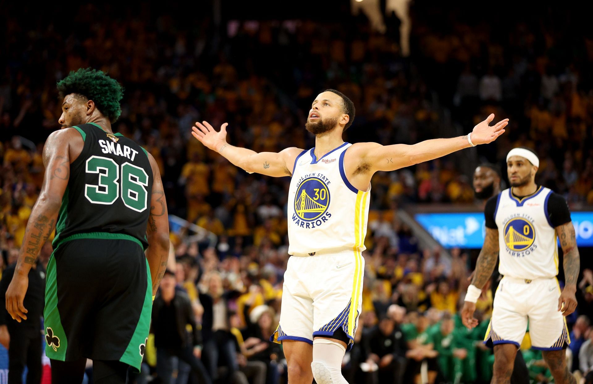 Steph Curry of the Golden State Warriors reacts to a basket during the fourth quarter against the Boston Celtics.