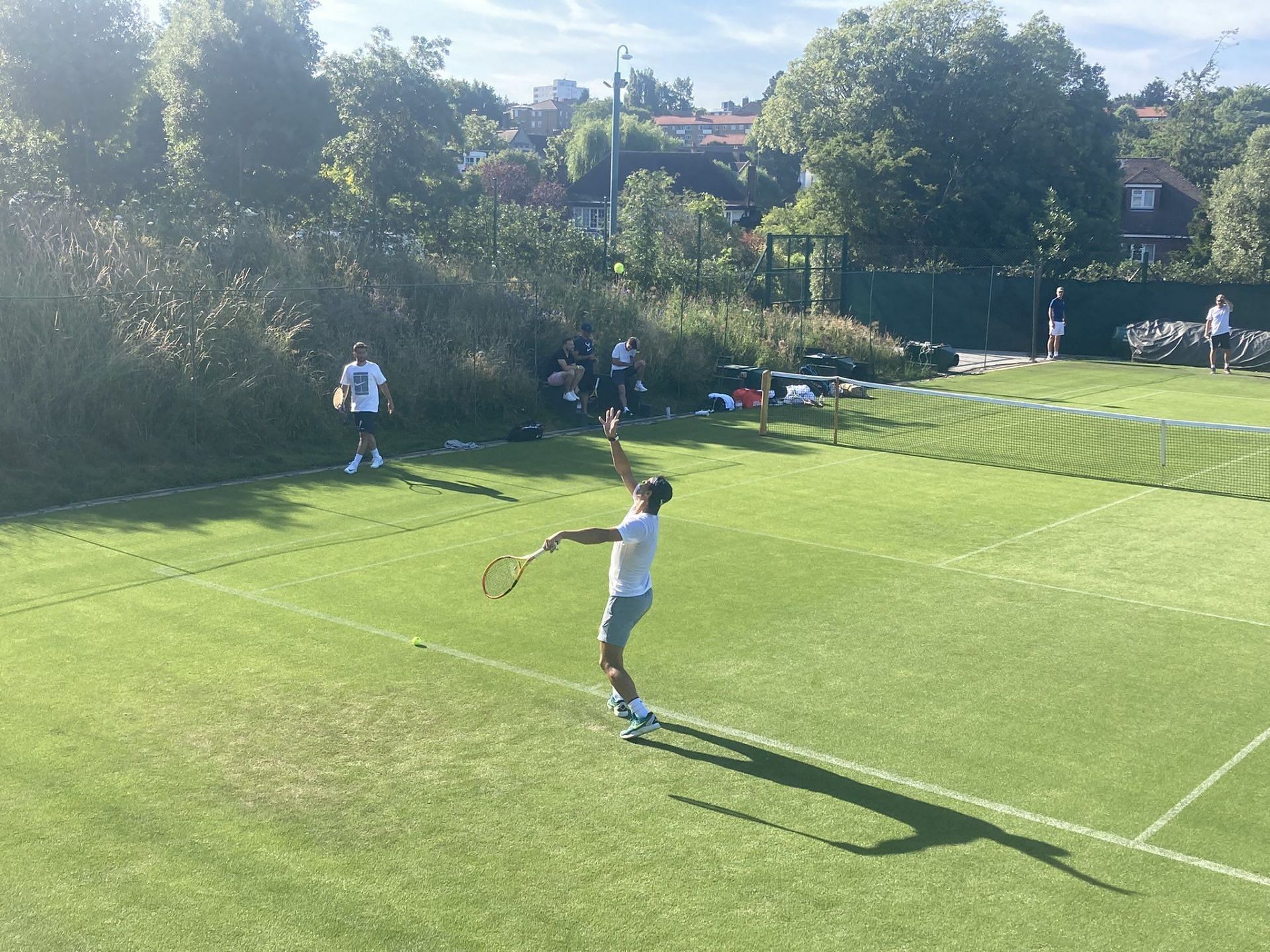 The World No. 4 serves during his practice session