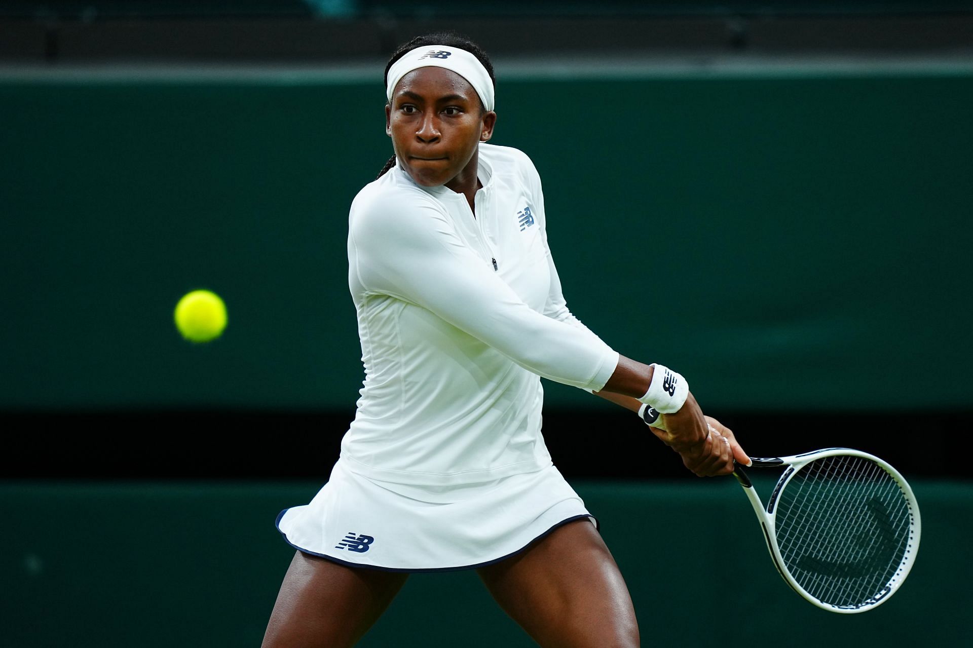 Coco Gauff attempts to strike the ball at Wimbledon 2021