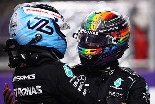 Valtteri Bottas (left) and Lewis Hamilton (right) share a moment during the 2021 F1 Saudi Arabian GP weekend. (Photo by Lars Baron/Getty Images)