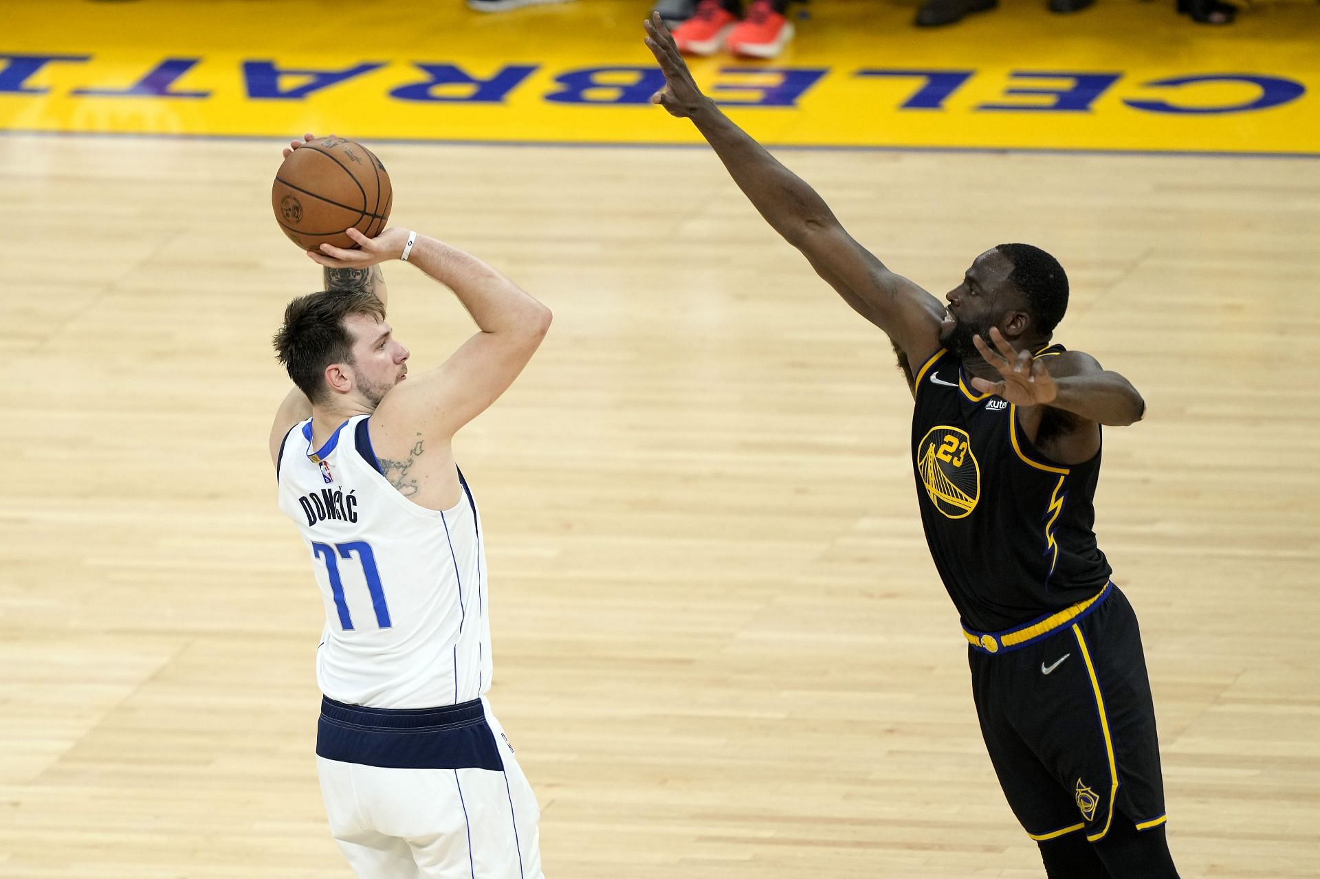 Dallas Mavericks v Golden State Warriors - Game Five; Luka Doncic shoots over Draymond Green