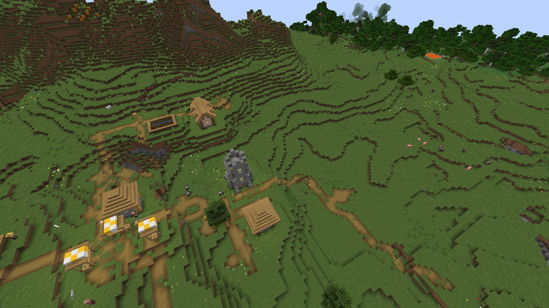 The plains village and lava pool near spawn (Image via Minecraft)